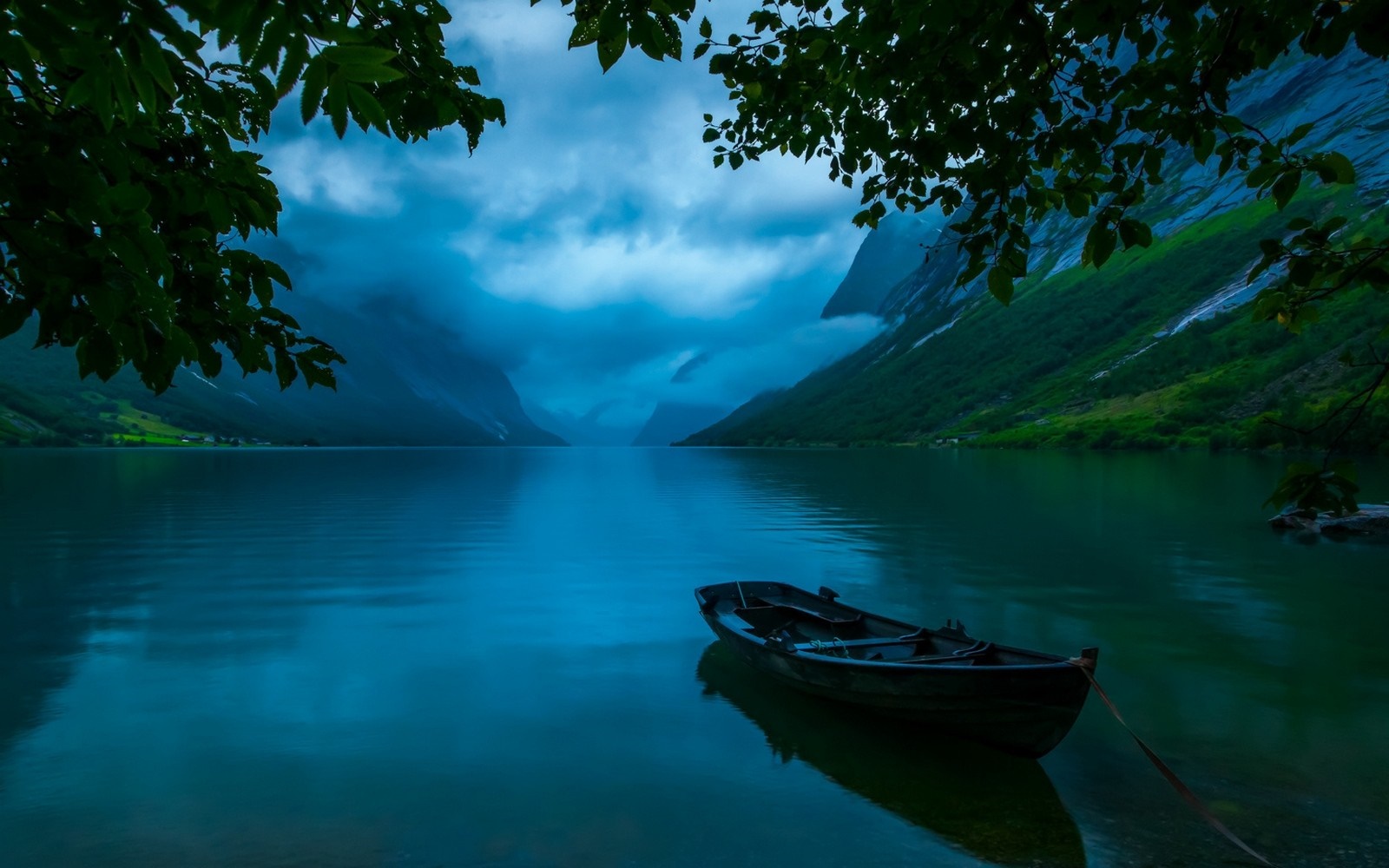 Boat on a lake in a Norwegian fjord HD Wallpaper