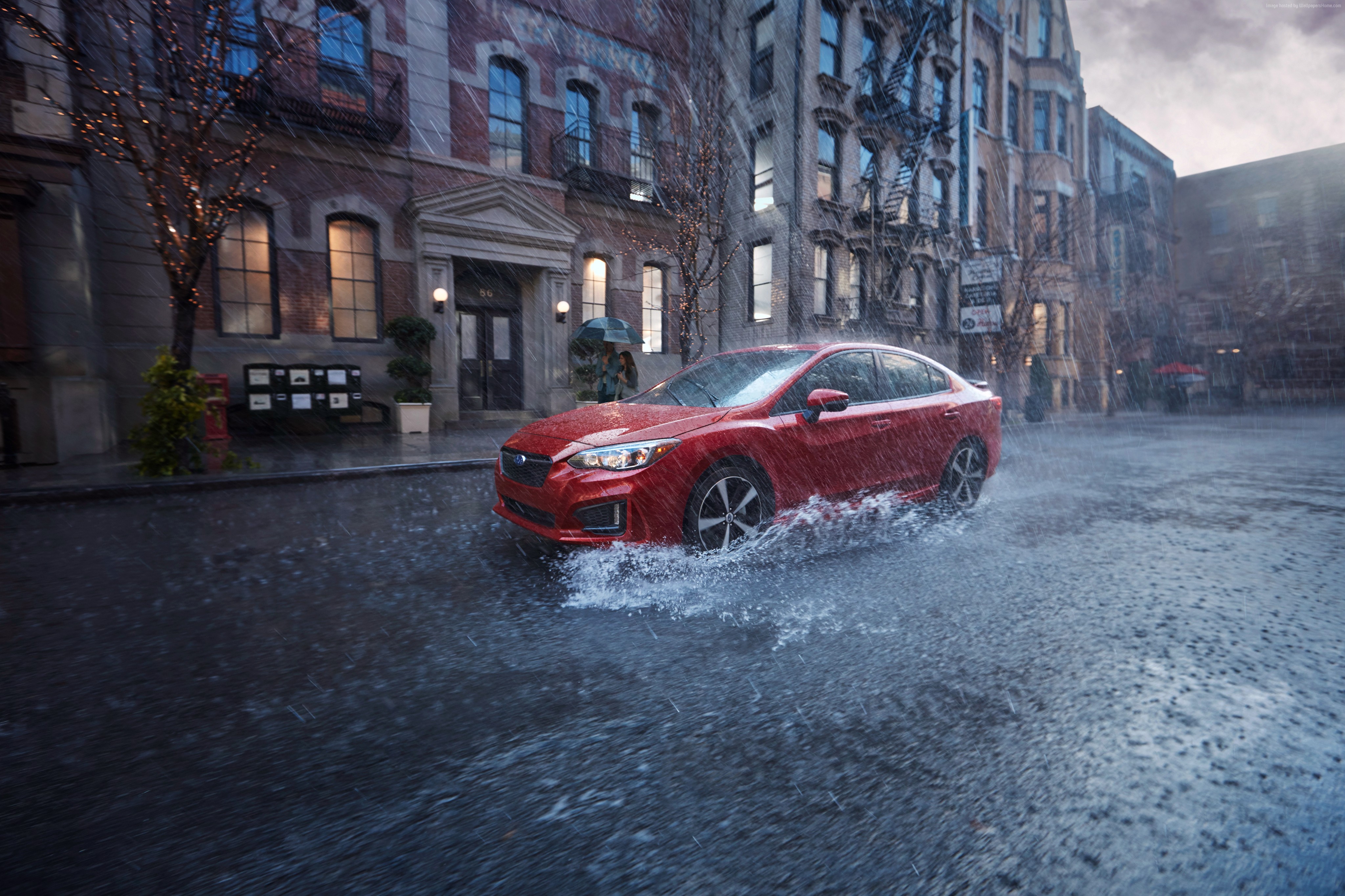 Red Subaru Impreza sedan driving through rain in city HD Wallpaper