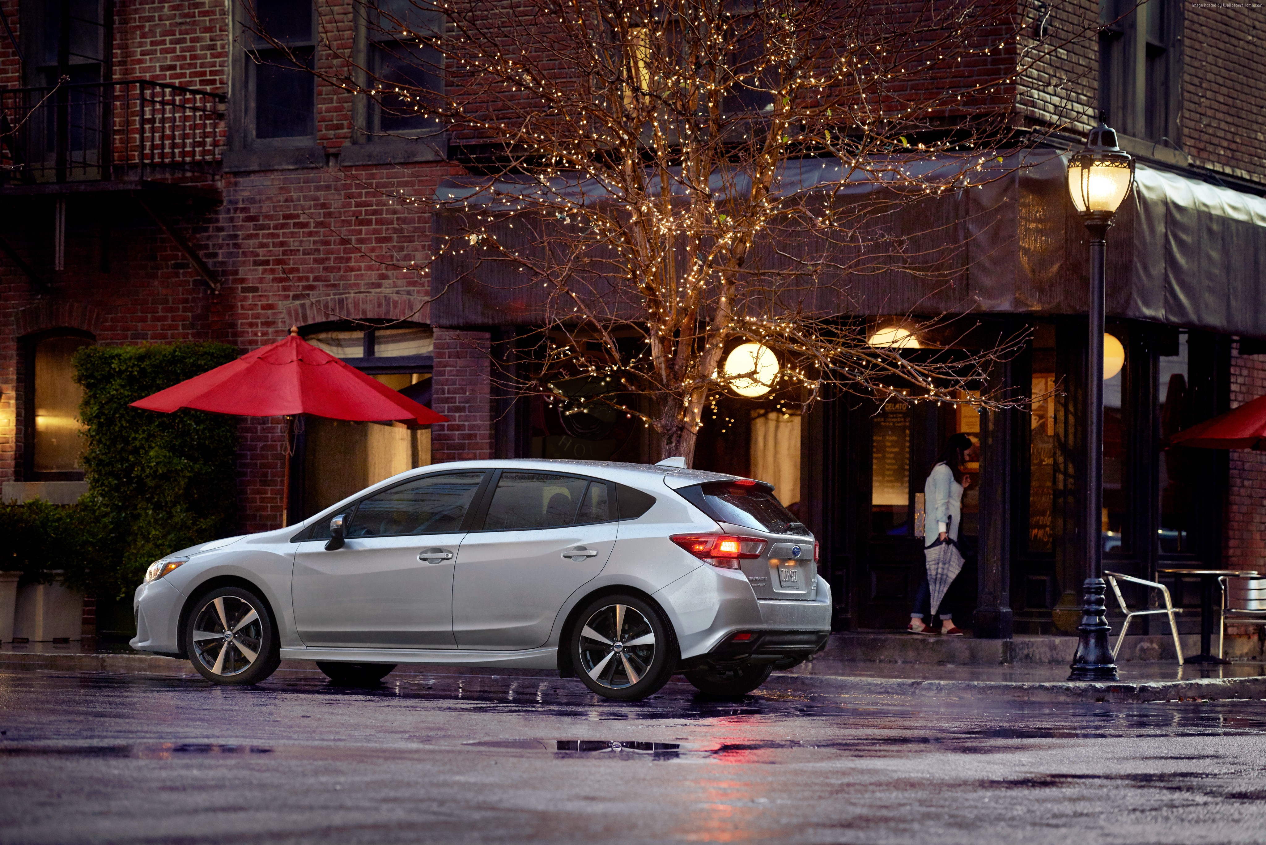 Silver Subaru Impreza 5-door sport parked on wet street HD Wallpaper