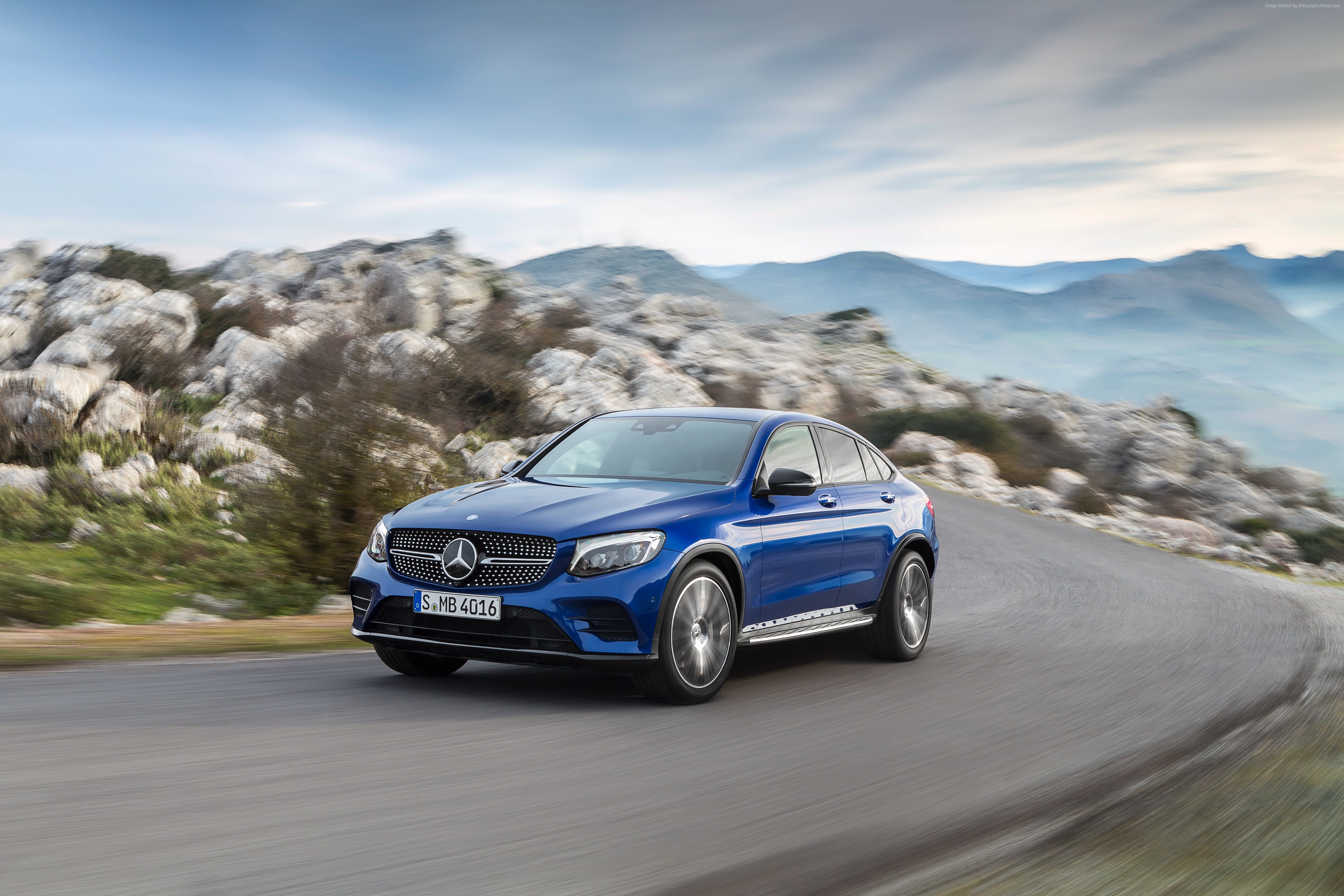 Blue Mercedes-Benz GLC Coupe driving on a mountain road HD Wallpaper