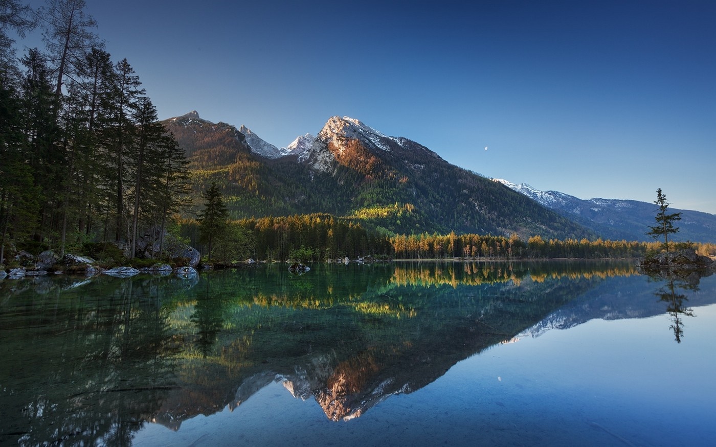 Mountain lake reflection with pine forest and snowy peaks HD Wallpaper