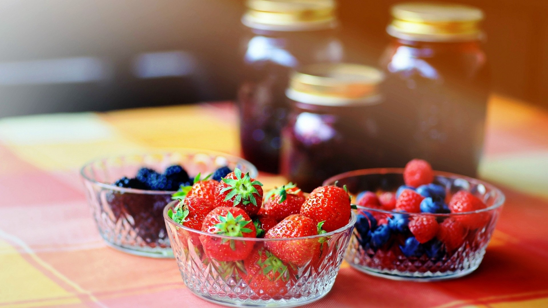 Bowls of berries and jars of jam HD Wallpaper