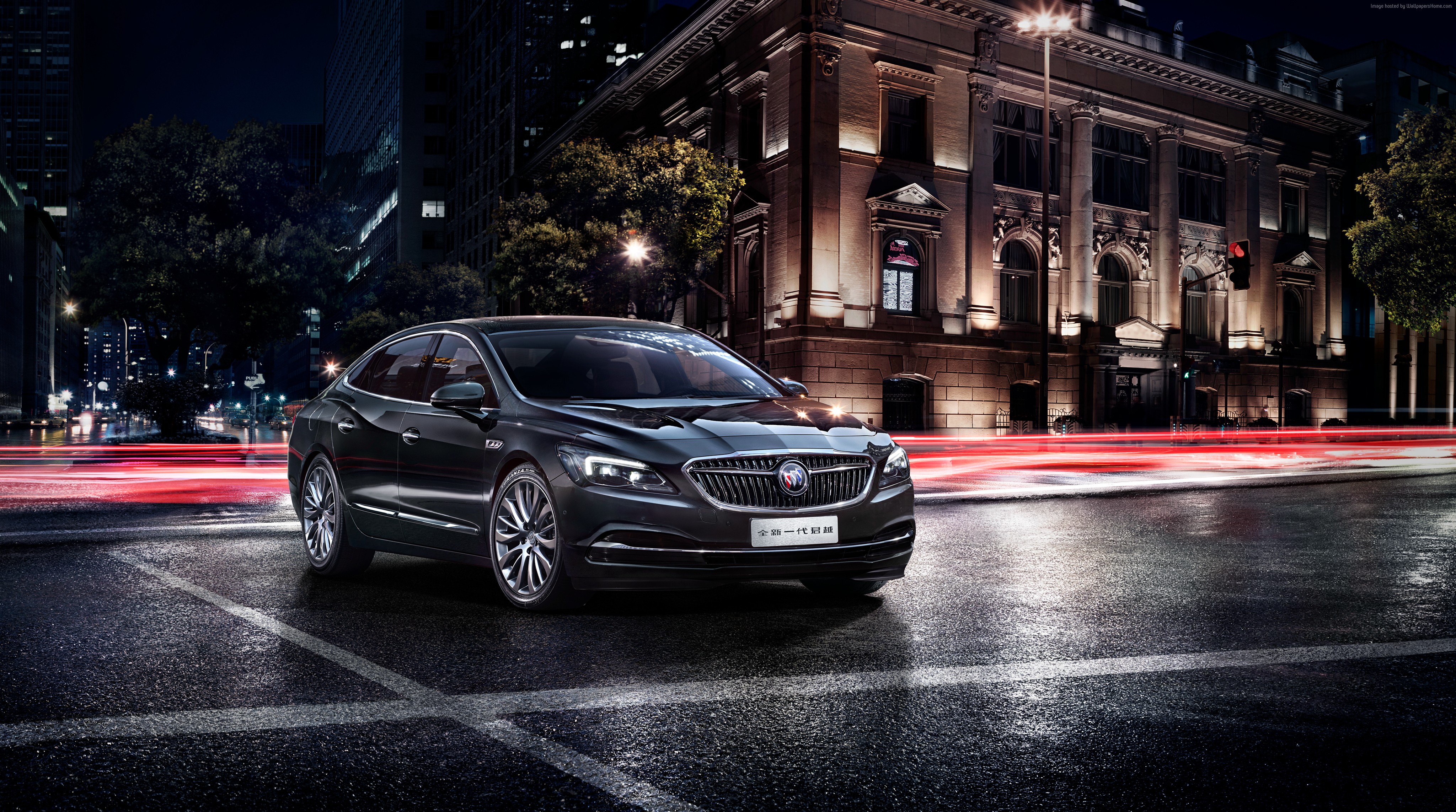 Black Buick LaCrosse sedan at night on city street HD Wallpaper