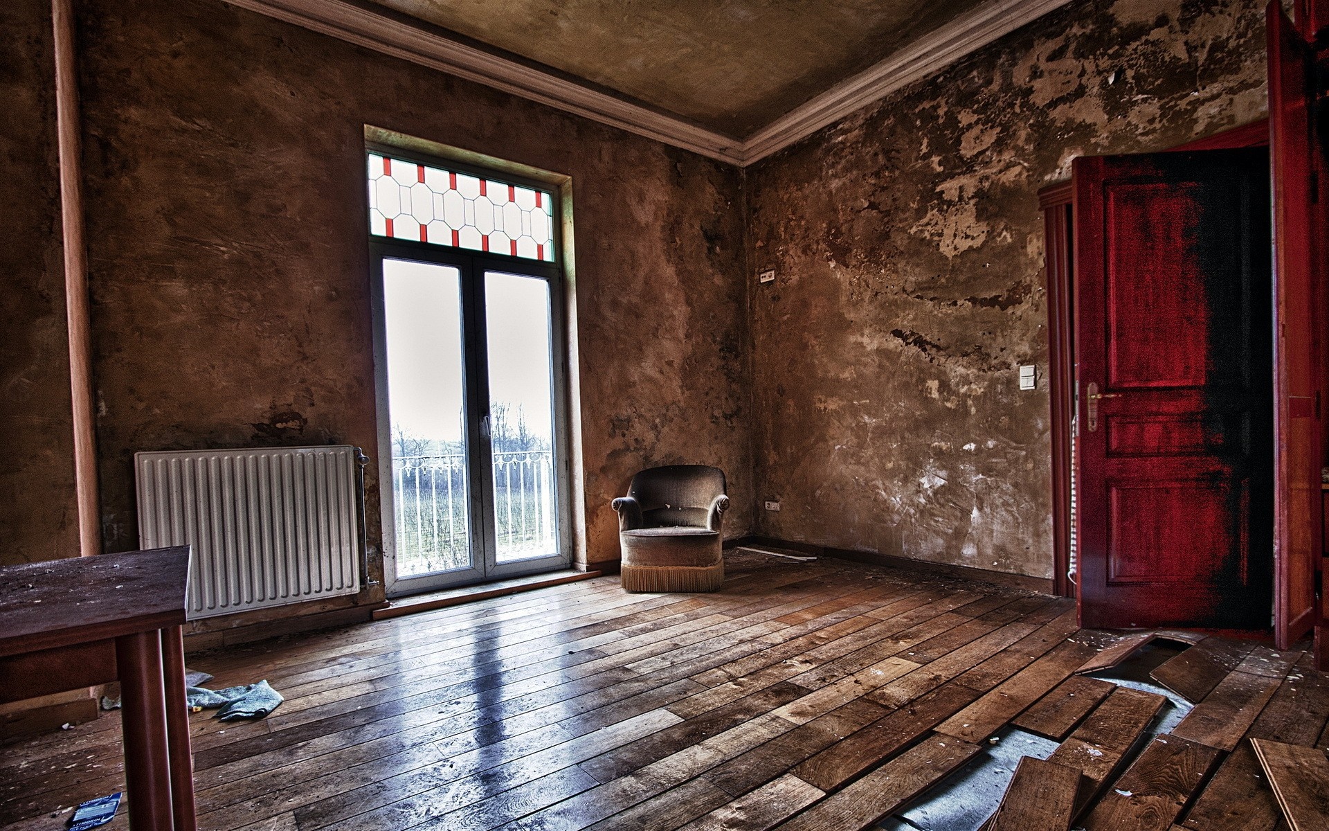 Abandoned room with armchair and broken floorboards HD Wallpaper