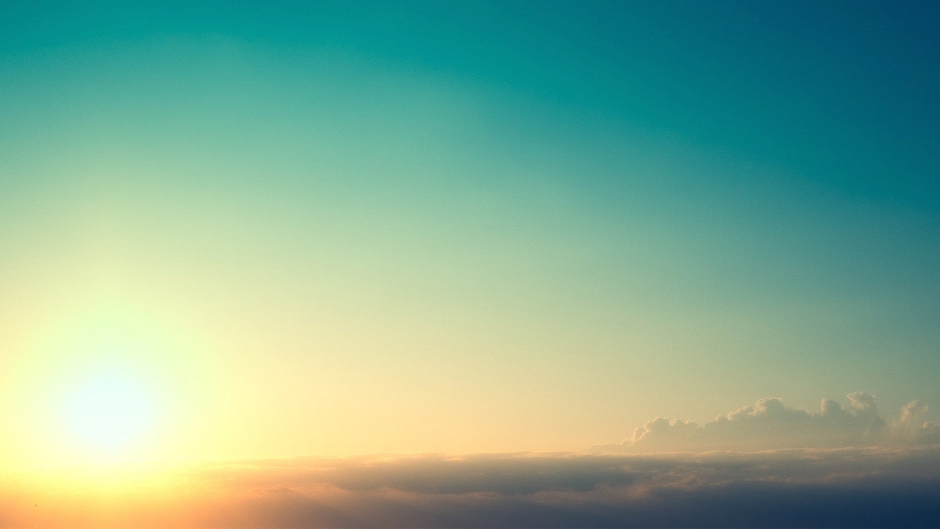 Sunset over clouds with sun and sky HD Wallpaper