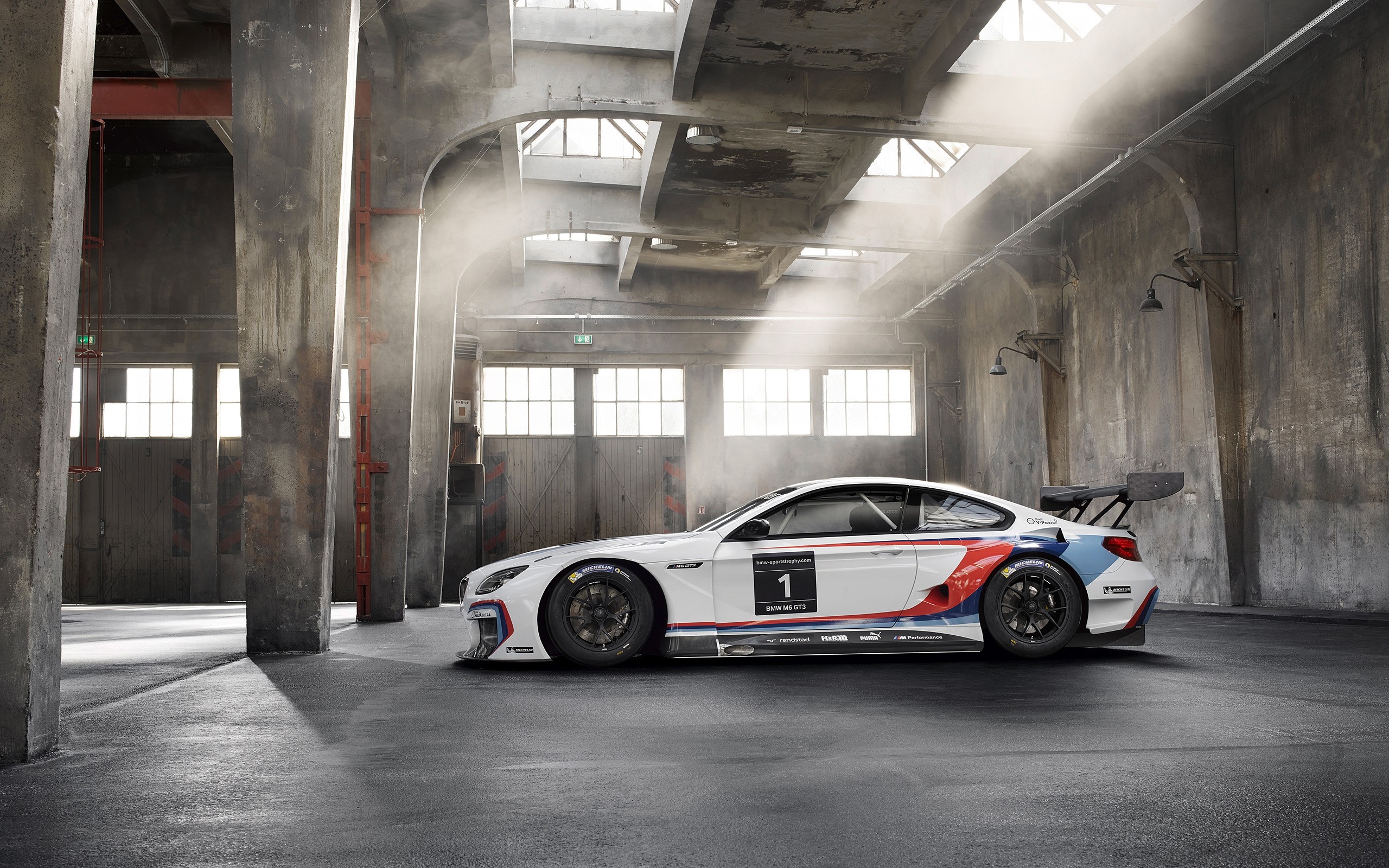 BMW M6 GT3 race car in industrial building HD Wallpaper