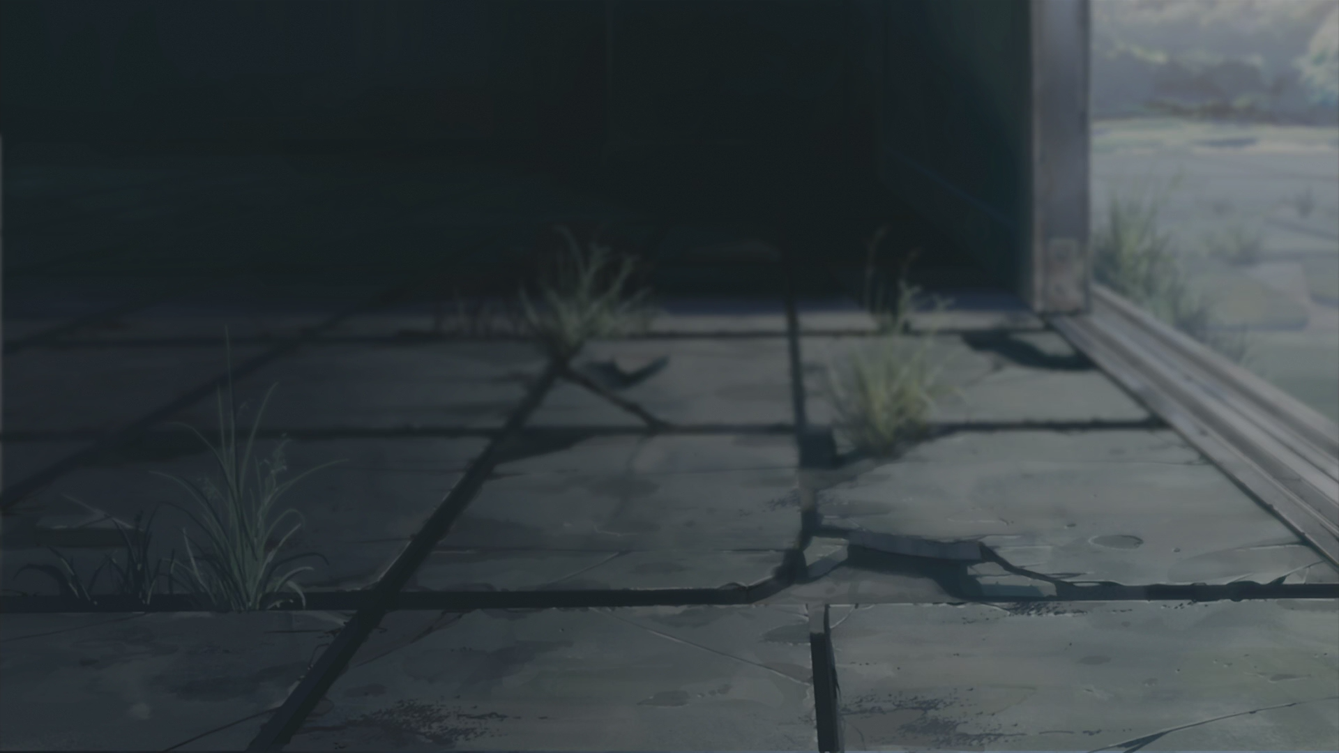 Cracked concrete floor with grass and an opening HD Wallpaper