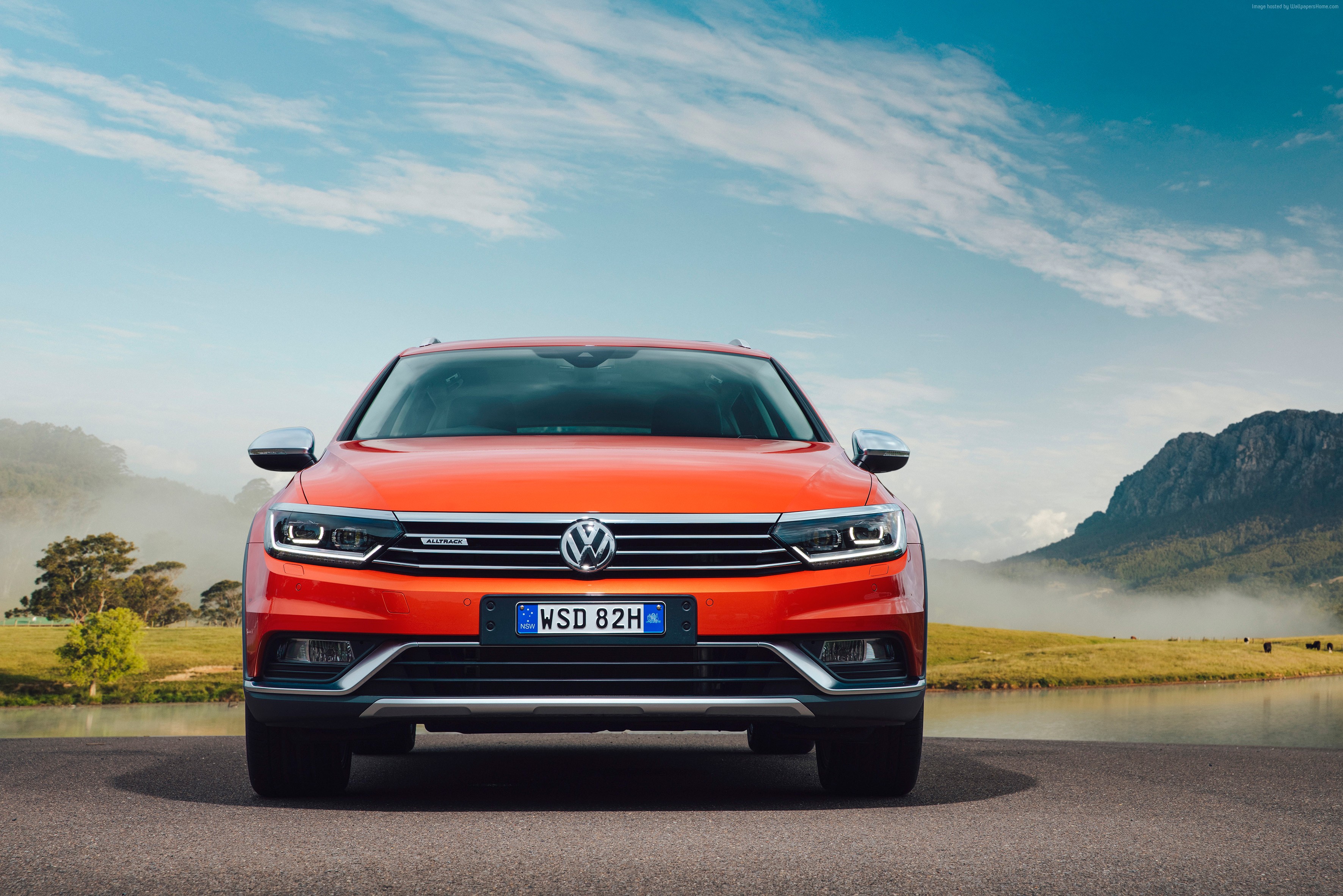 Orange Volkswagen Passat Alltrack parked by a lake HD Wallpaper