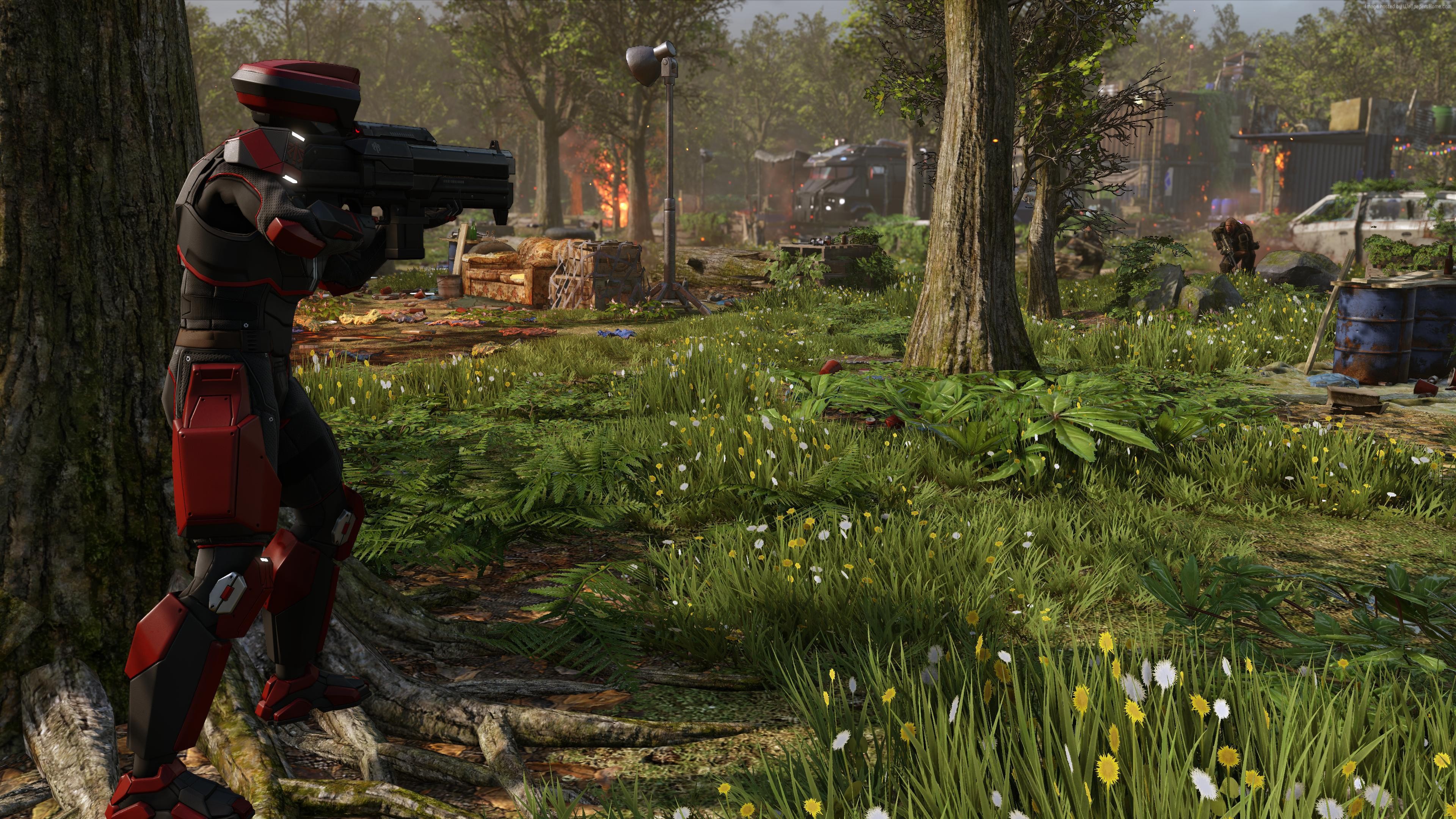 XCOM 2 soldier in a forest with burning buildings HD Wallpaper
