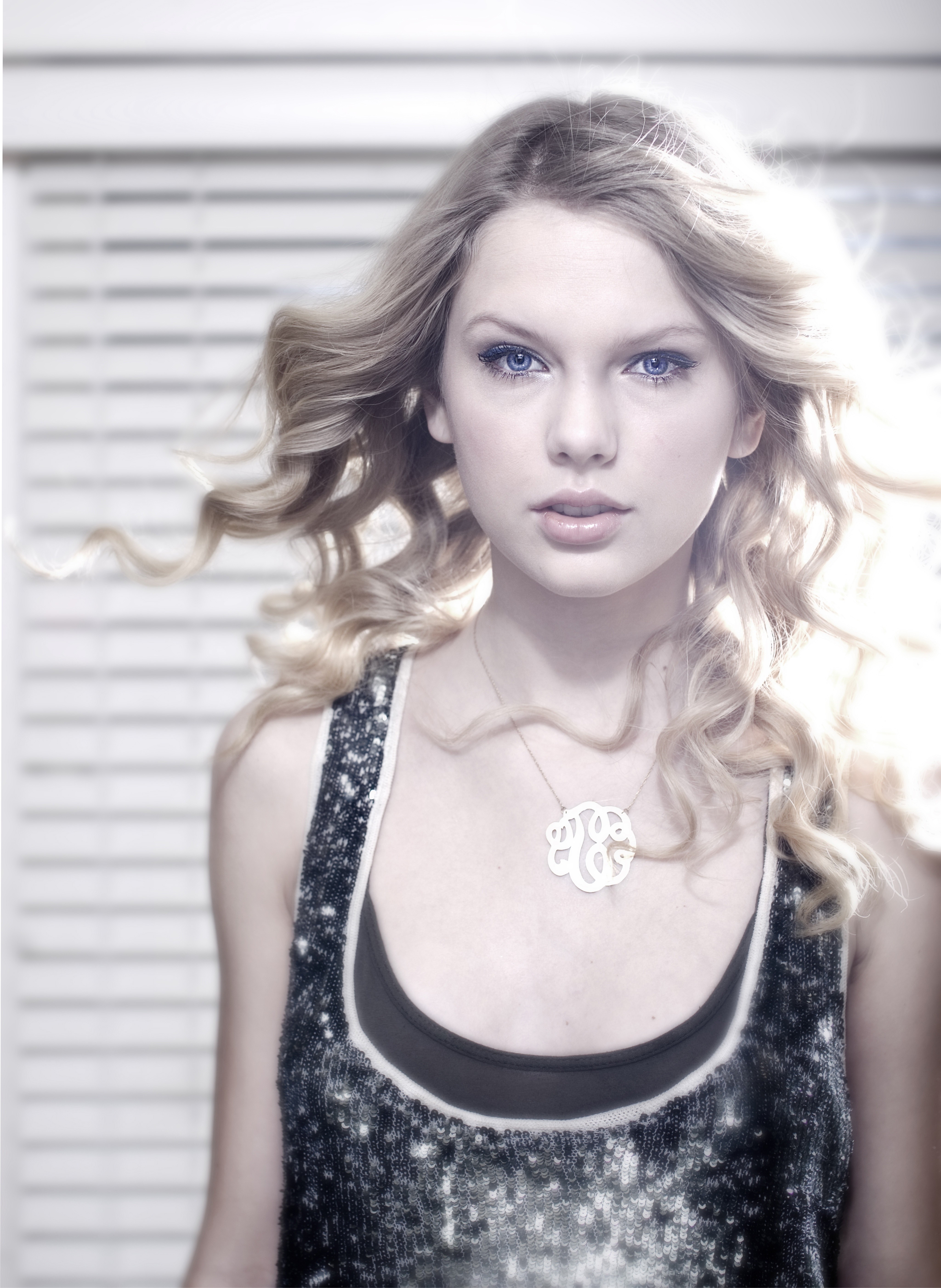 Taylor Swift wearing a sequined top and monogram necklace HD Wallpaper