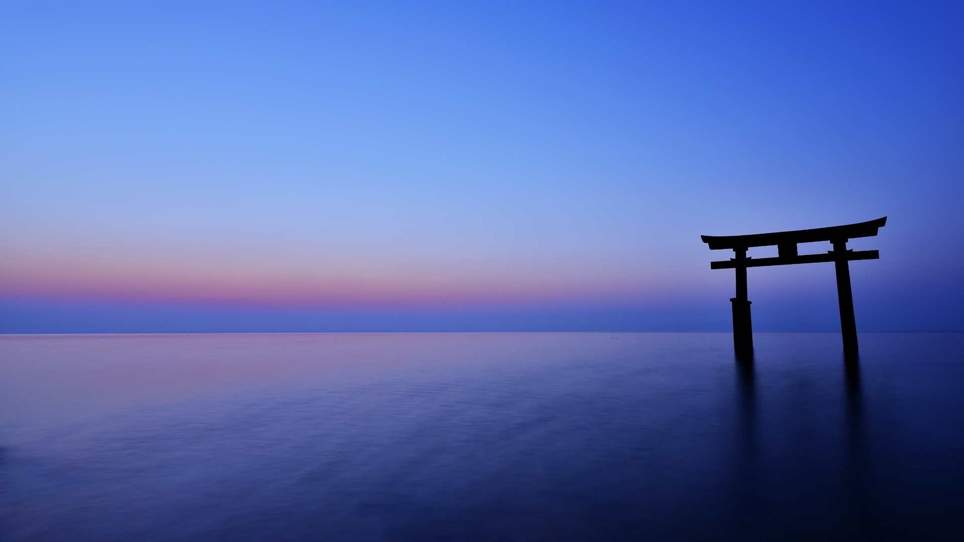 Torii gate in the ocean at sunset HD Wallpaper