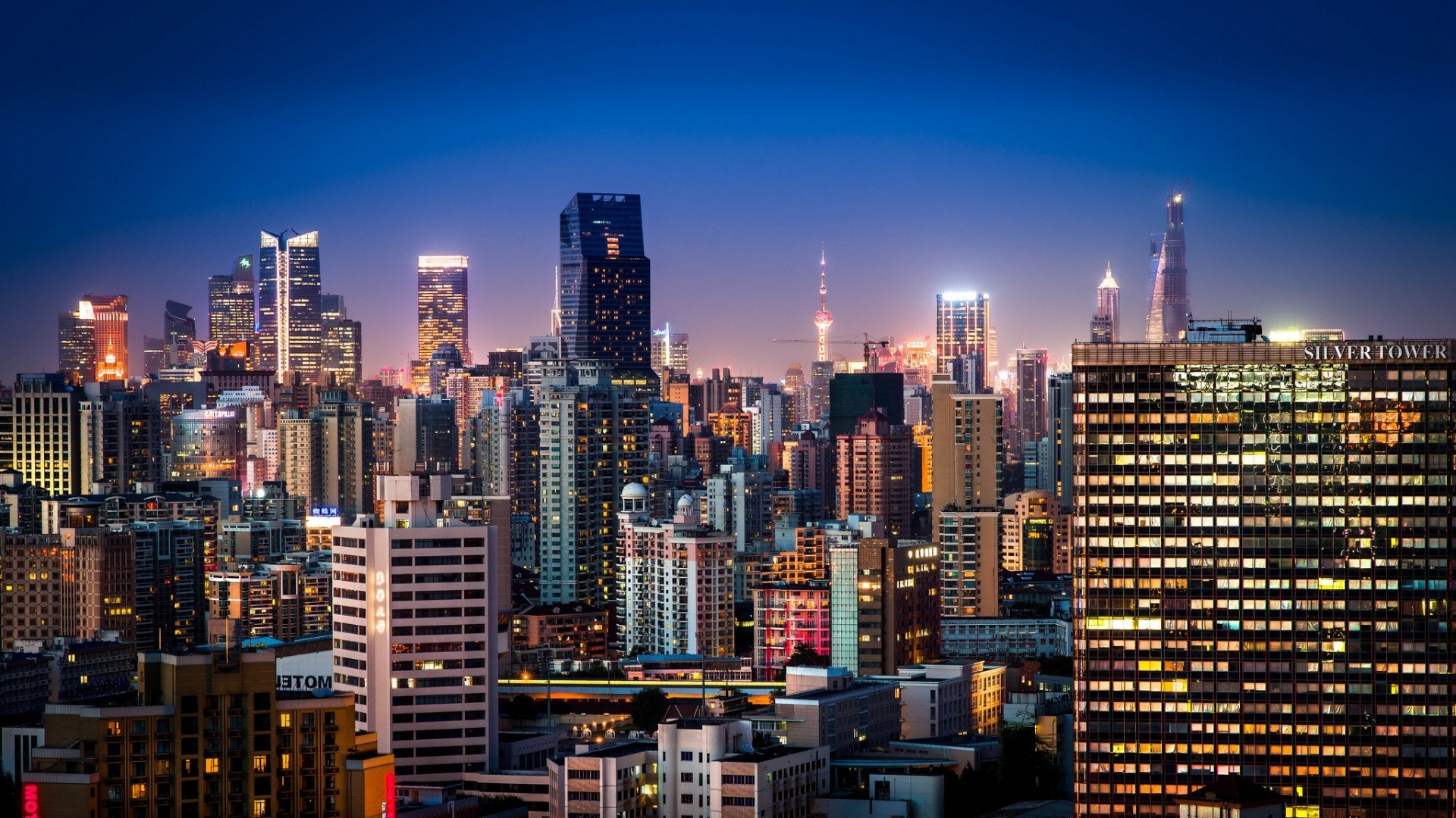 Shanghai cityscape at night with illuminated skyscrapers HD Wallpaper