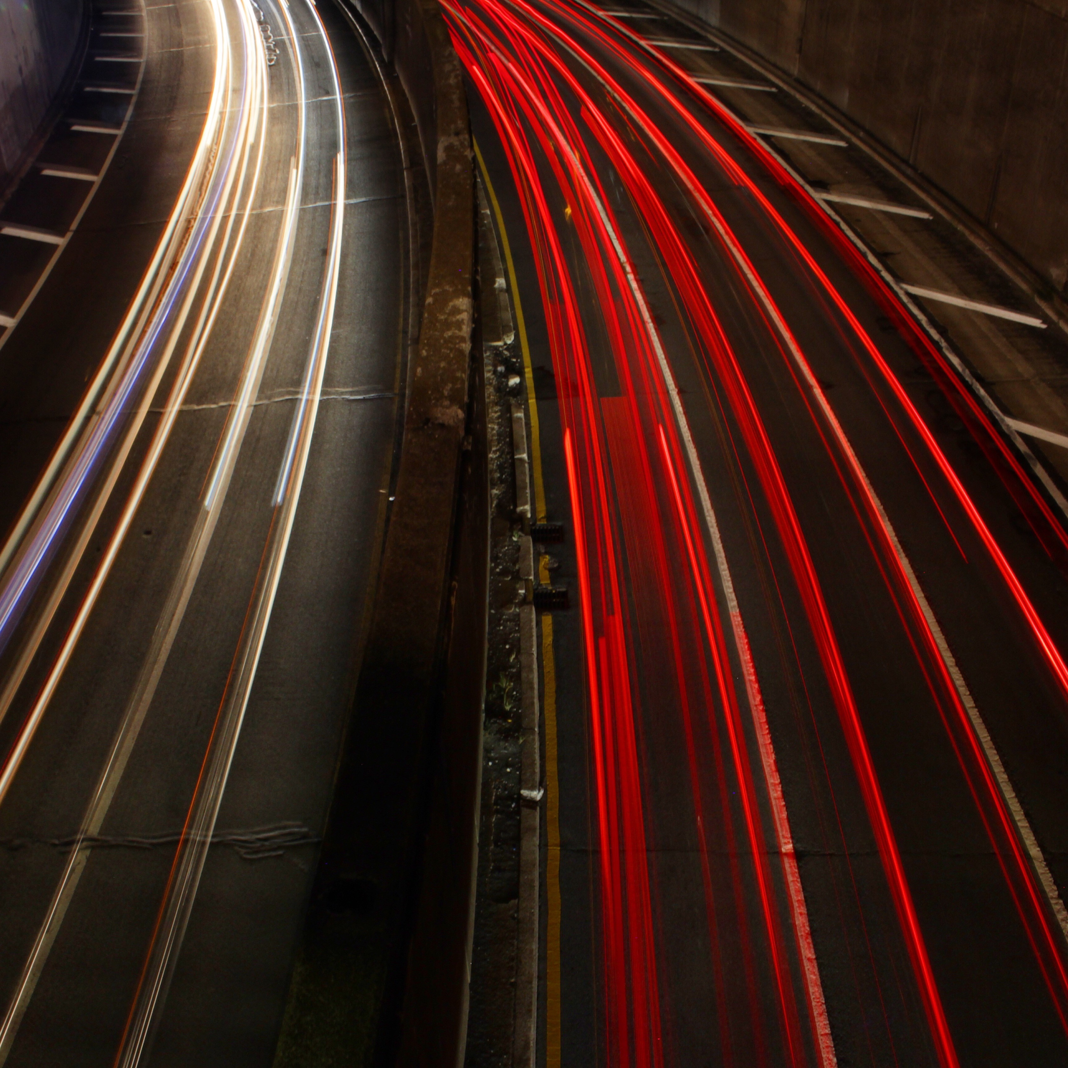 Light trails on a highway at night HD Wallpaper