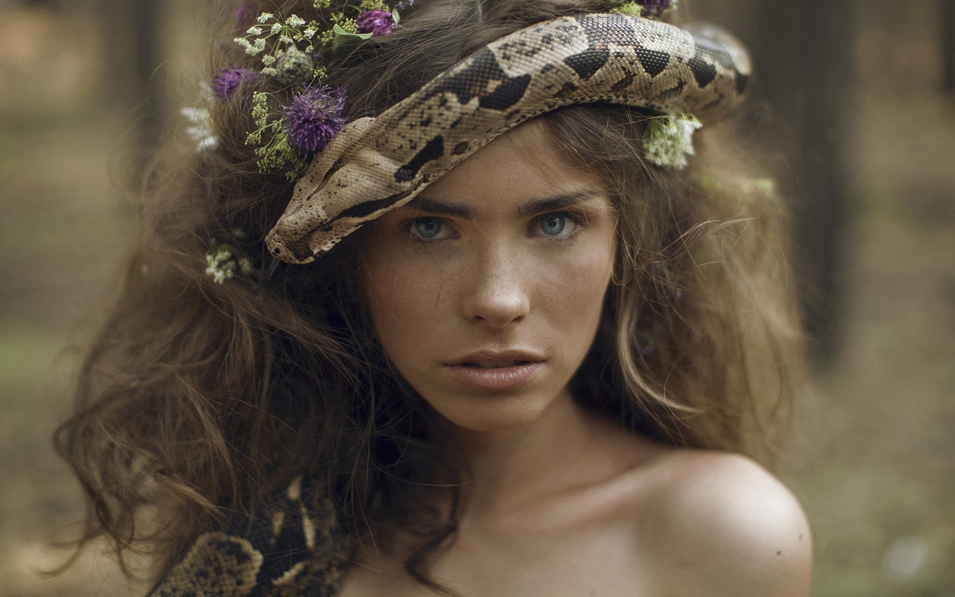 Woman with snake and flowers in hair HD Wallpaper