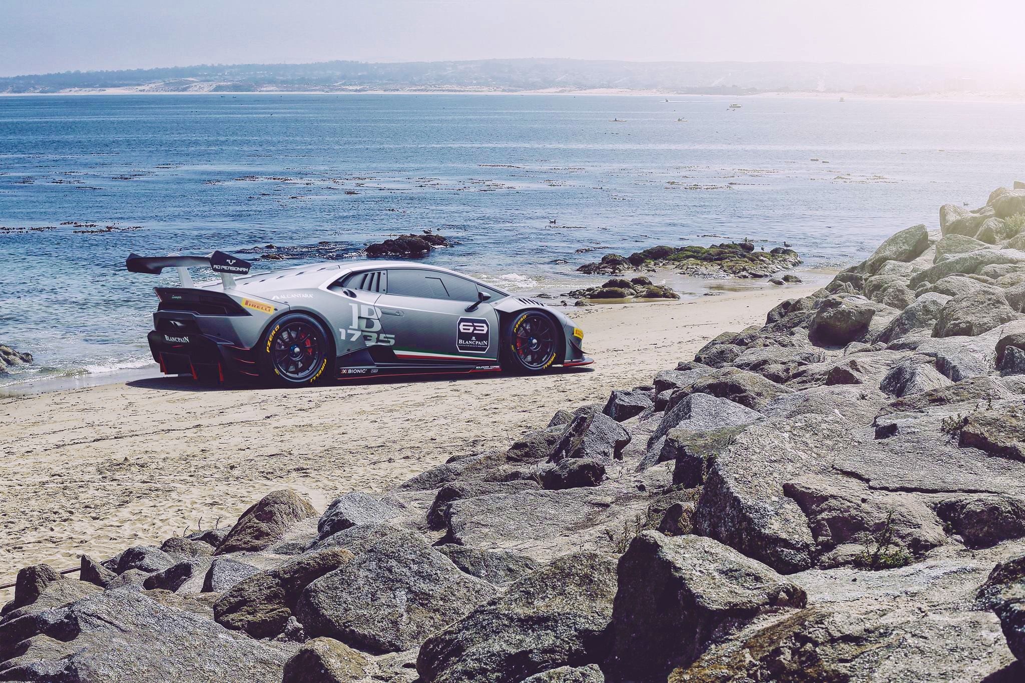 Lamborghini sports car on a sandy beach by the ocean HD Wallpaper