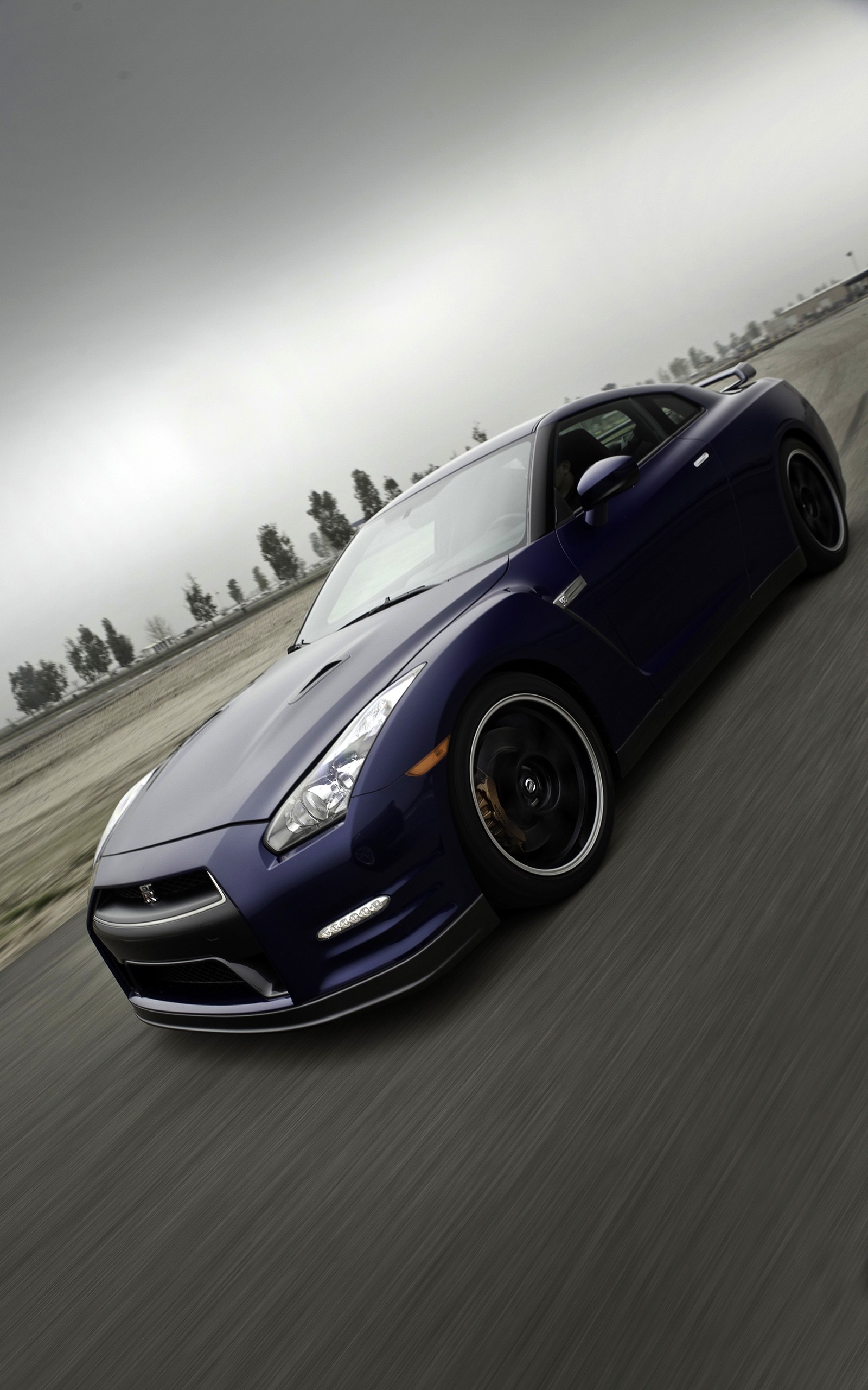 Nissan GT-R R35 sports car on a road HD Wallpaper