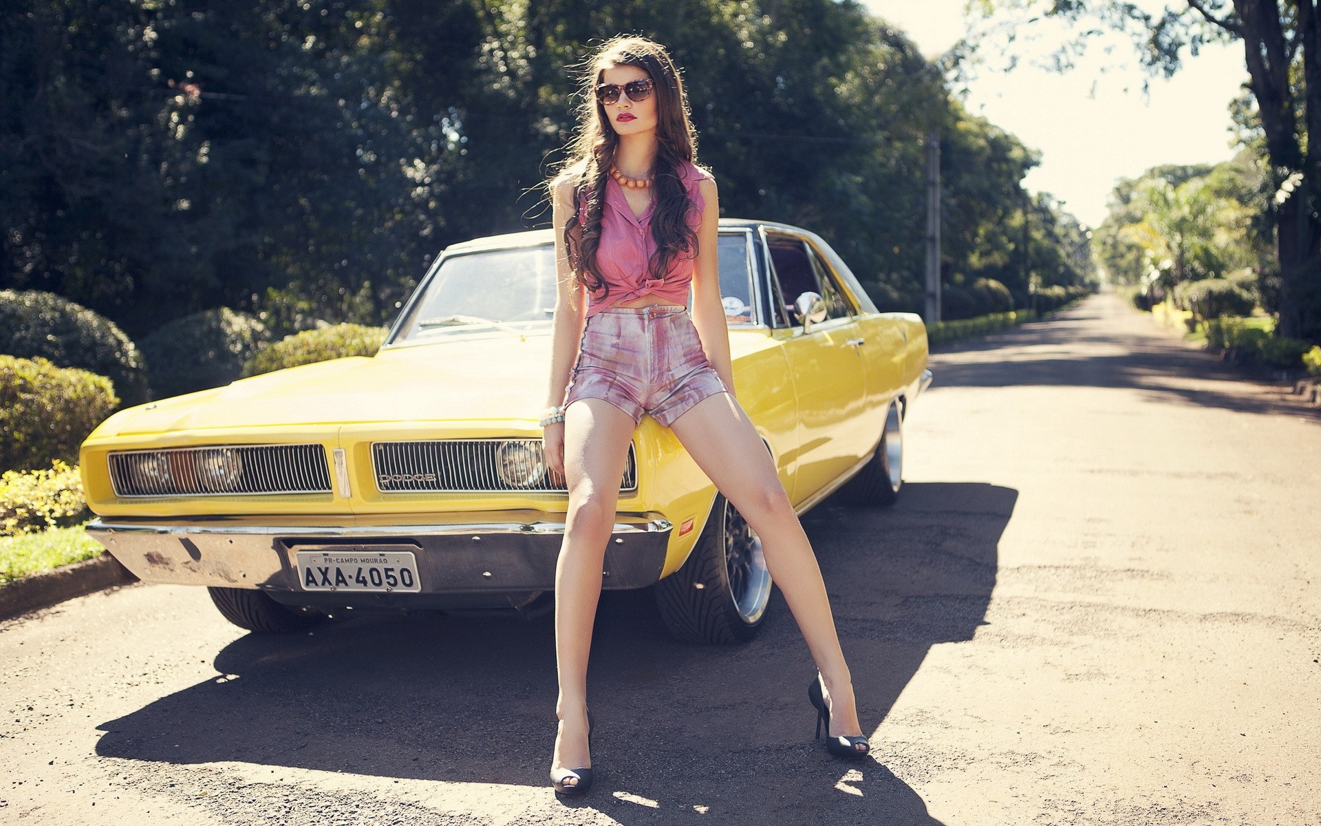 Woman posing with a yellow Dodge Charger HD Wallpaper