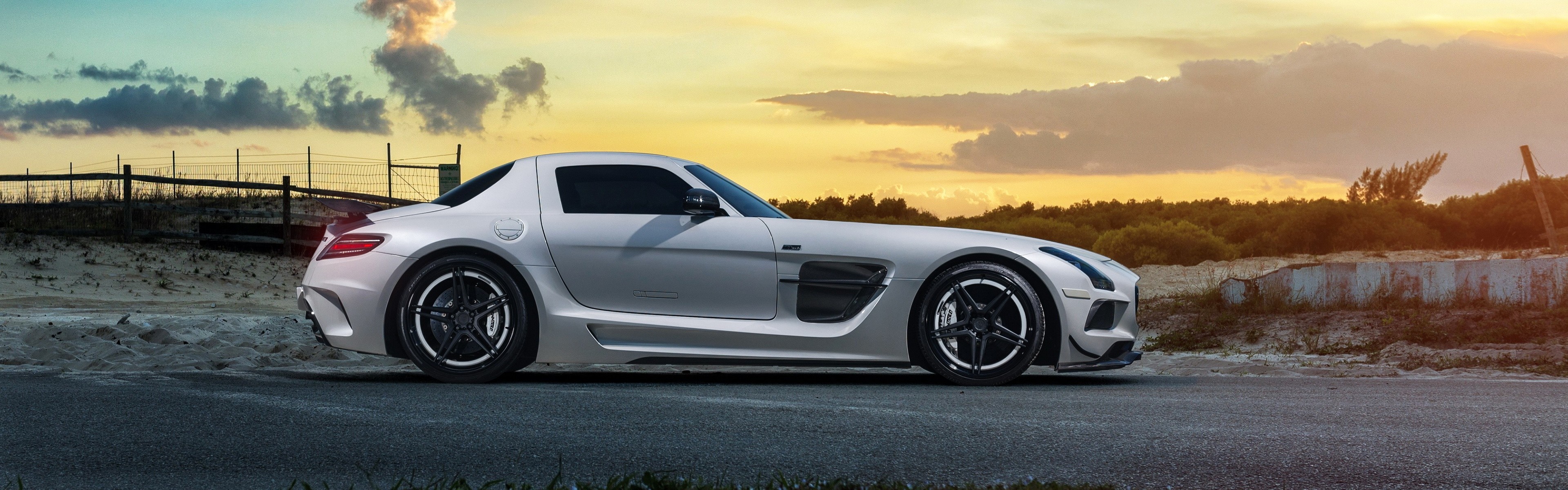 White Mercedes Benz SLS AMG sports car at sunset HD Wallpaper