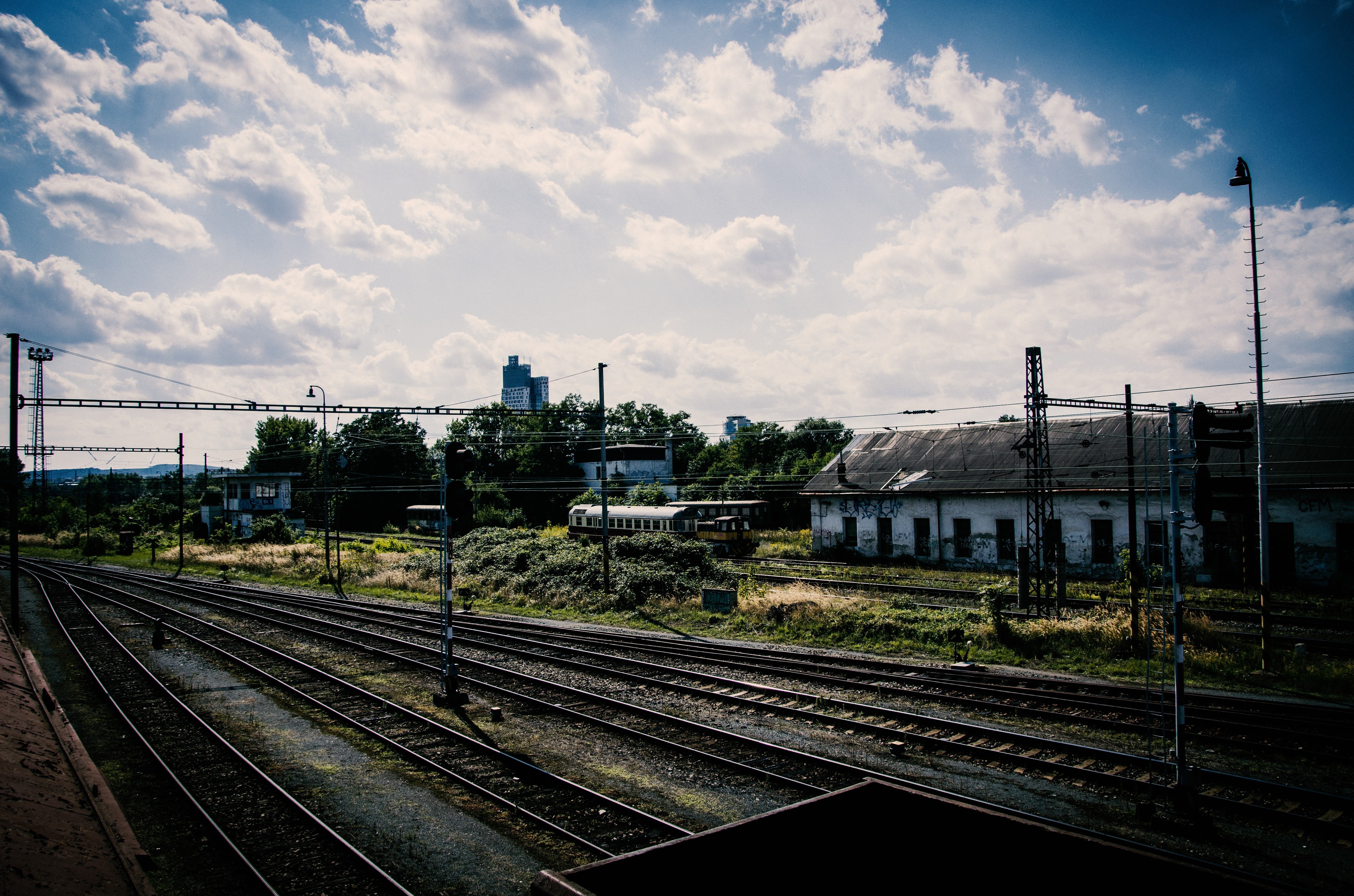 Abandoned train station with old buildings and tracks HD Wallpaper