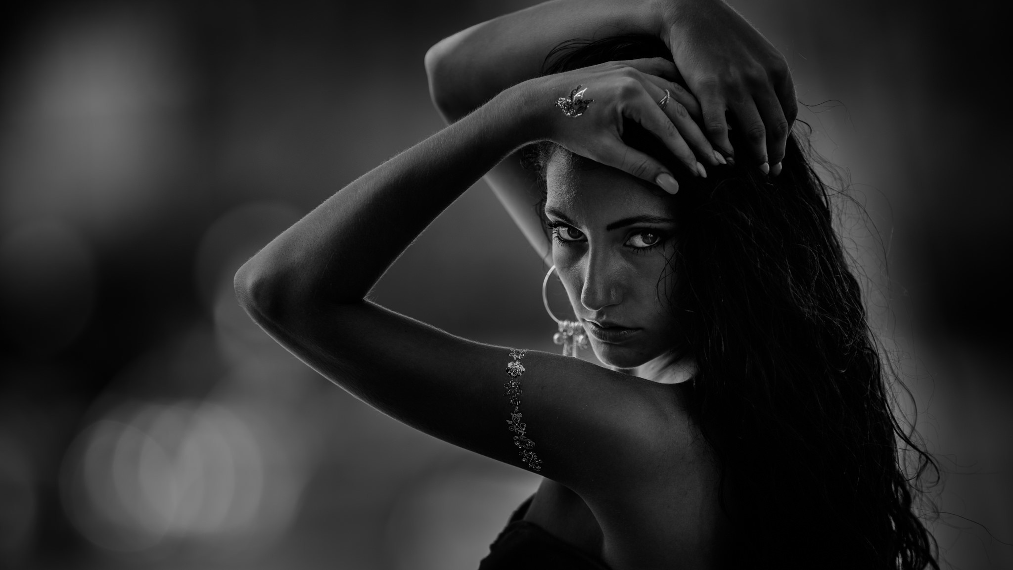 Monochrome portrait of a woman with arms up HD Wallpaper
