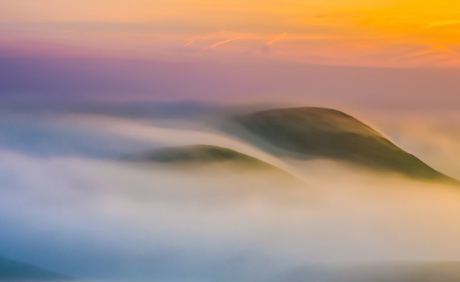 Misty mountains at sunrise with colorful sky HD Wallpaper