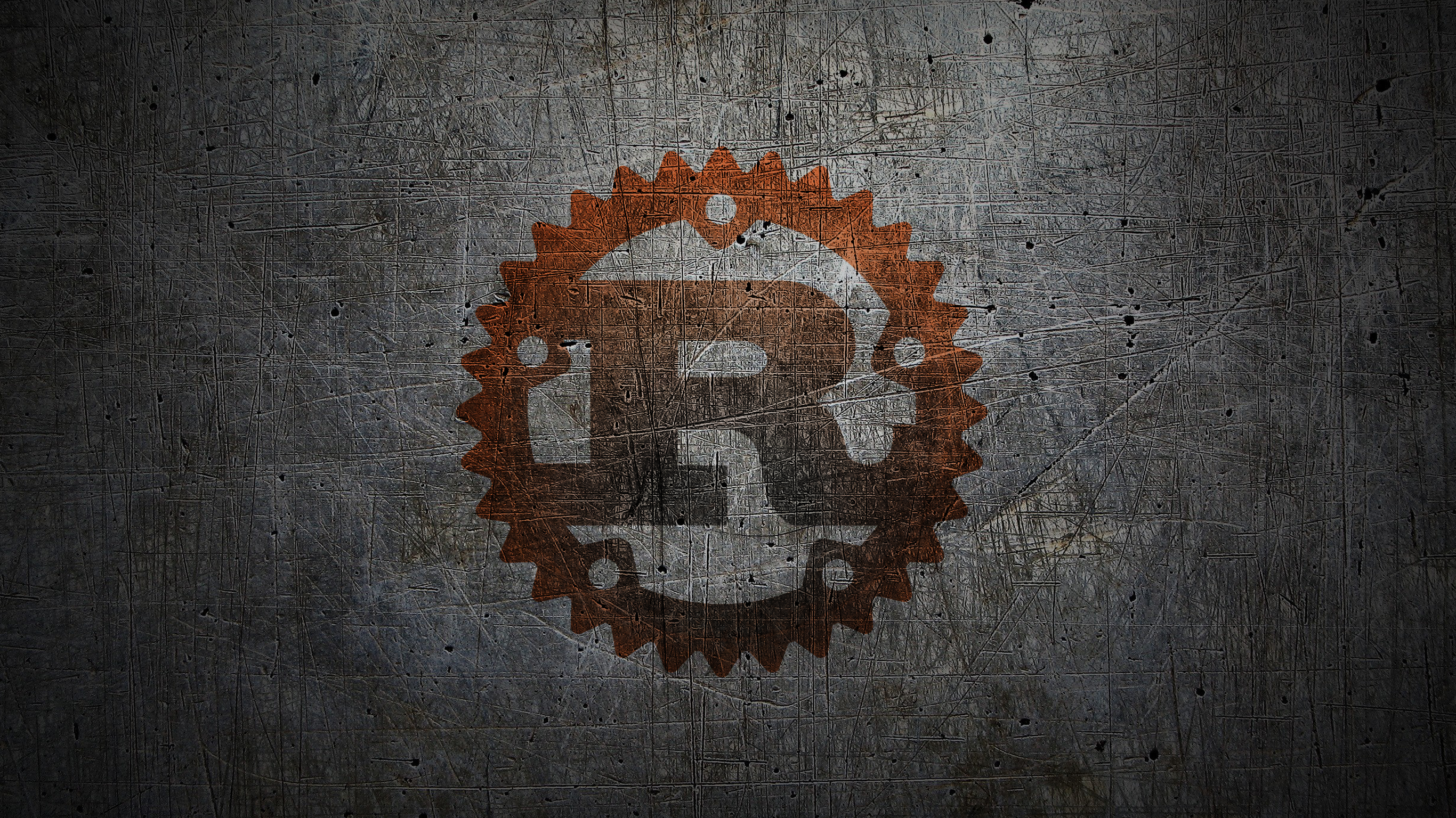 Rust programming language logo on a textured metal surface HD Wallpaper