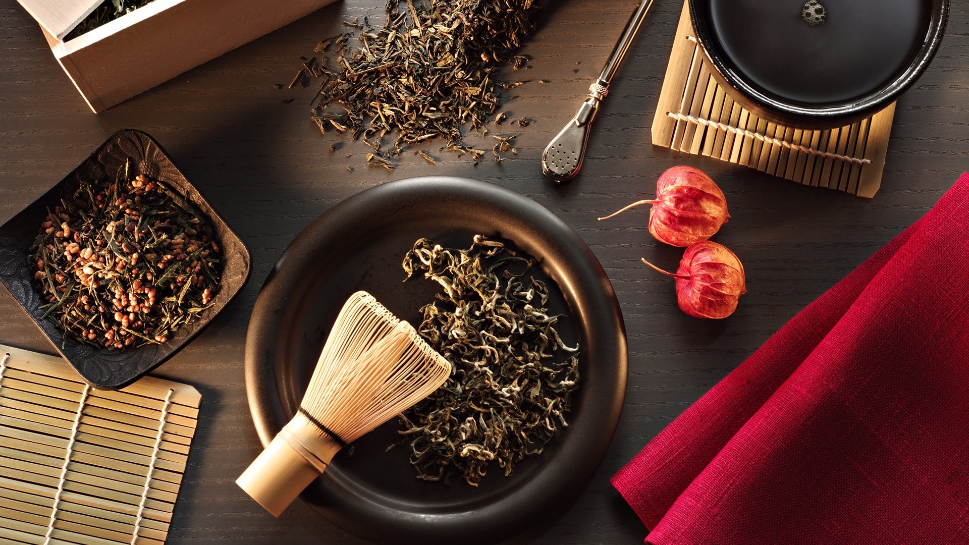 Tea ceremony setup with dried tea leaves and matcha whisk HD Wallpaper