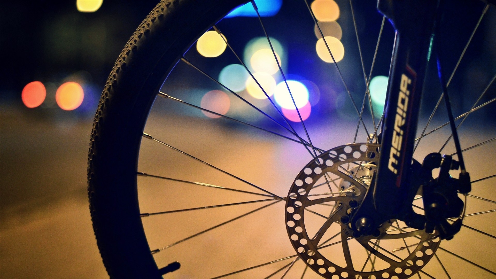 Merida Bicycle Wheel with Disc Brake at Night HD Wallpaper