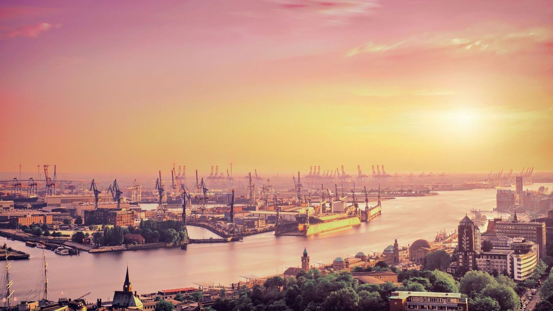 Hamburg harbor at sunset with cranes and ships HD Wallpaper