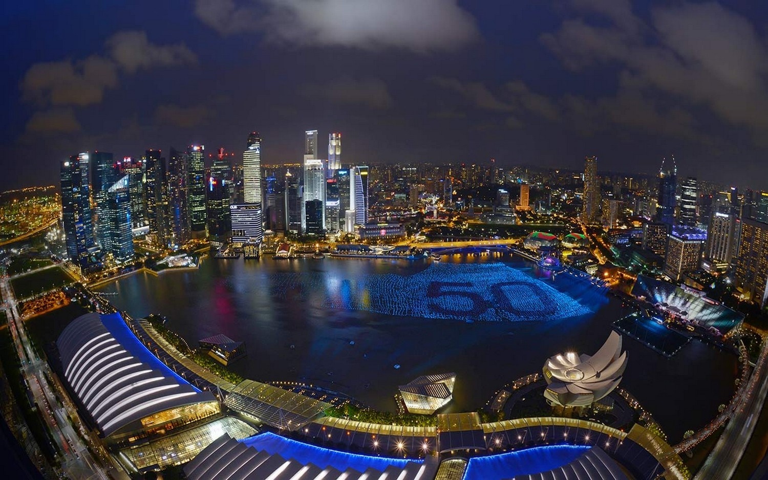 Singapore cityscape at night with '50' illuminated on the water HD Wallpaper
