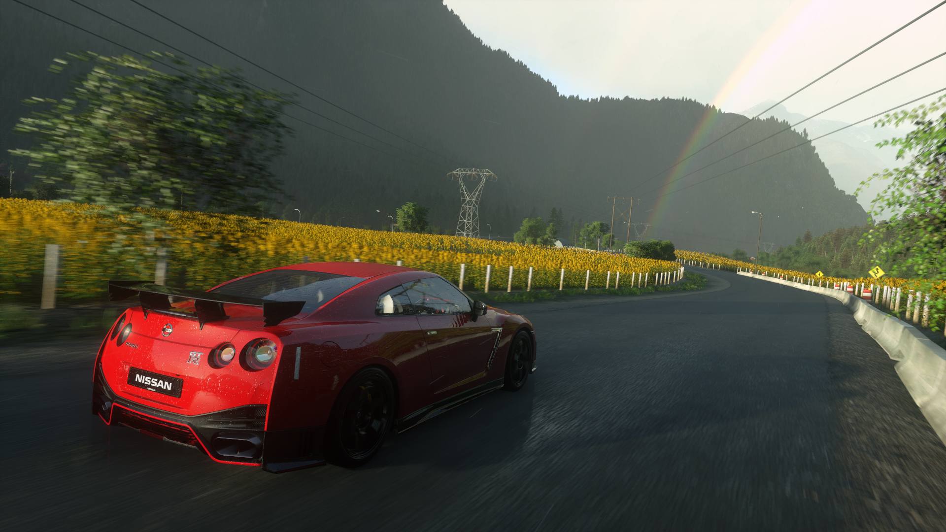 Red Nissan GT-R driving on a road with sunflowers and mountains HD Wallpaper