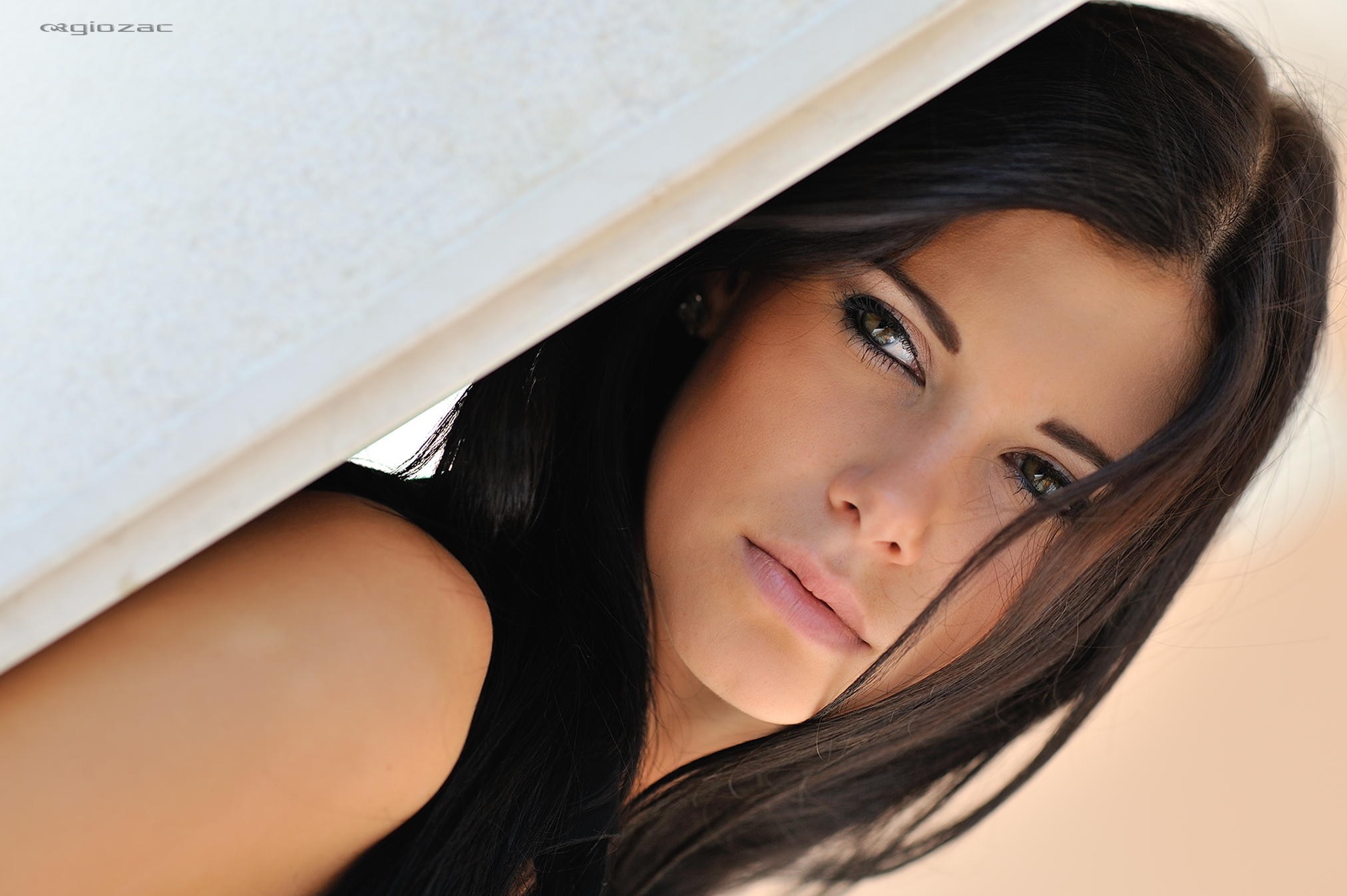 Woman with long dark hair and makeup HD Wallpaper