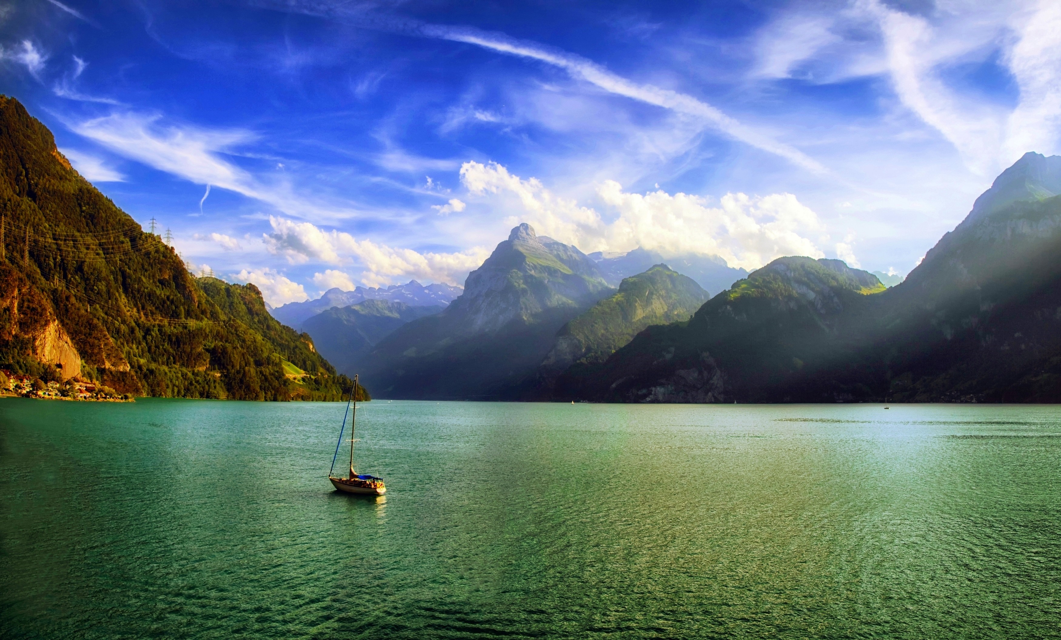 Sailboat on a lake with mountains and clouds HD Wallpaper