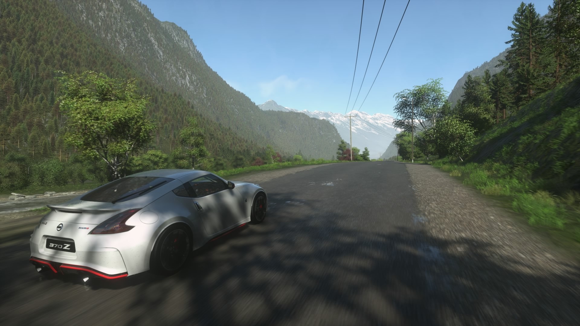 White Nissan 370Z driving on a mountain road HD Wallpaper