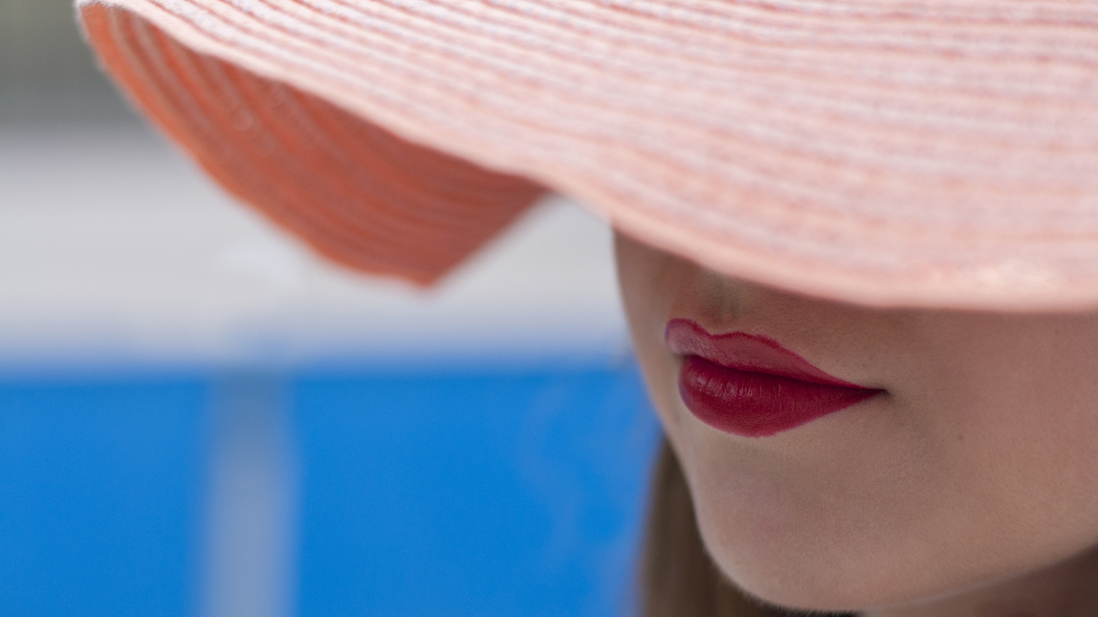 Woman wearing a pink hat with red lipstick HD Wallpaper