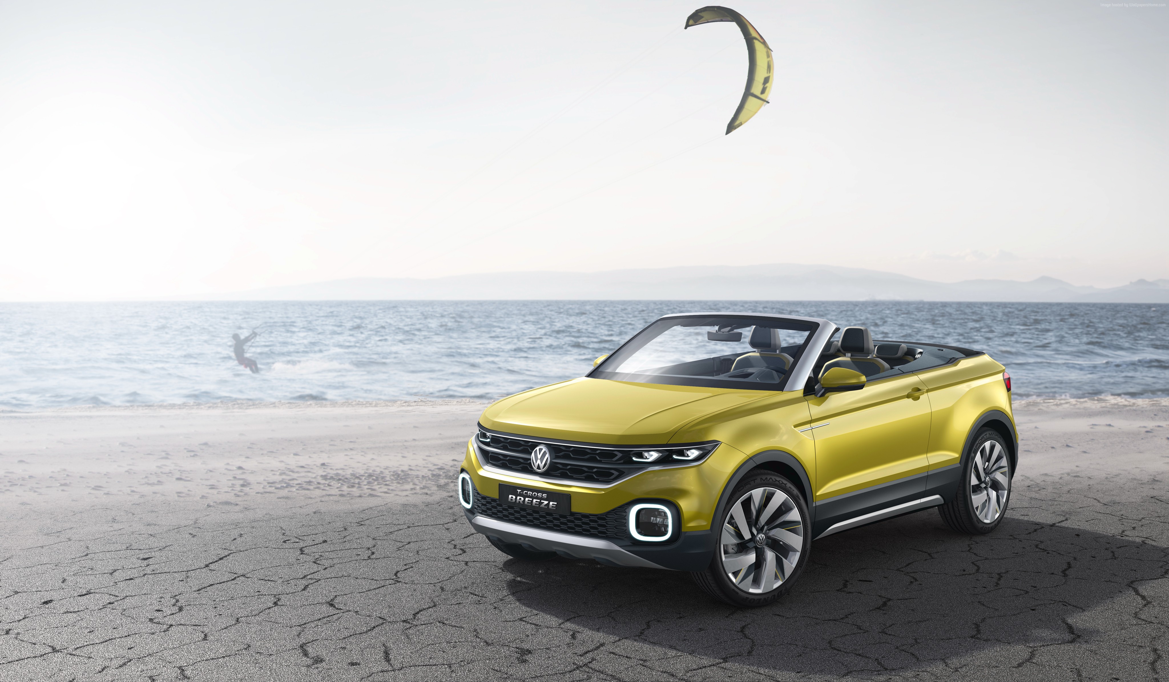 Yellow Volkswagen T-Cross Breeze convertible on a beach HD Wallpaper