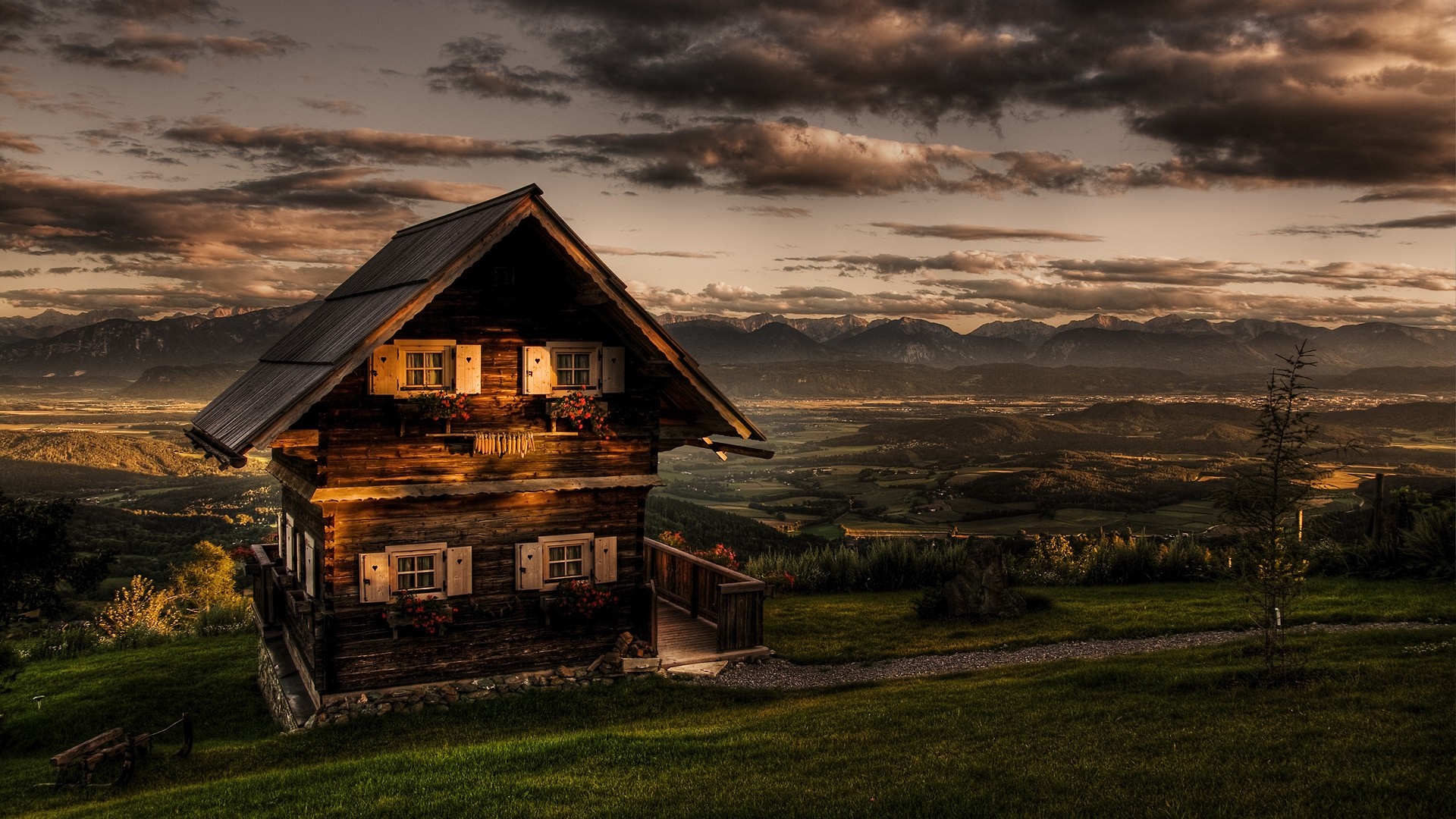 Wooden cabin on a hill overlooking mountains at sunset HD Wallpaper