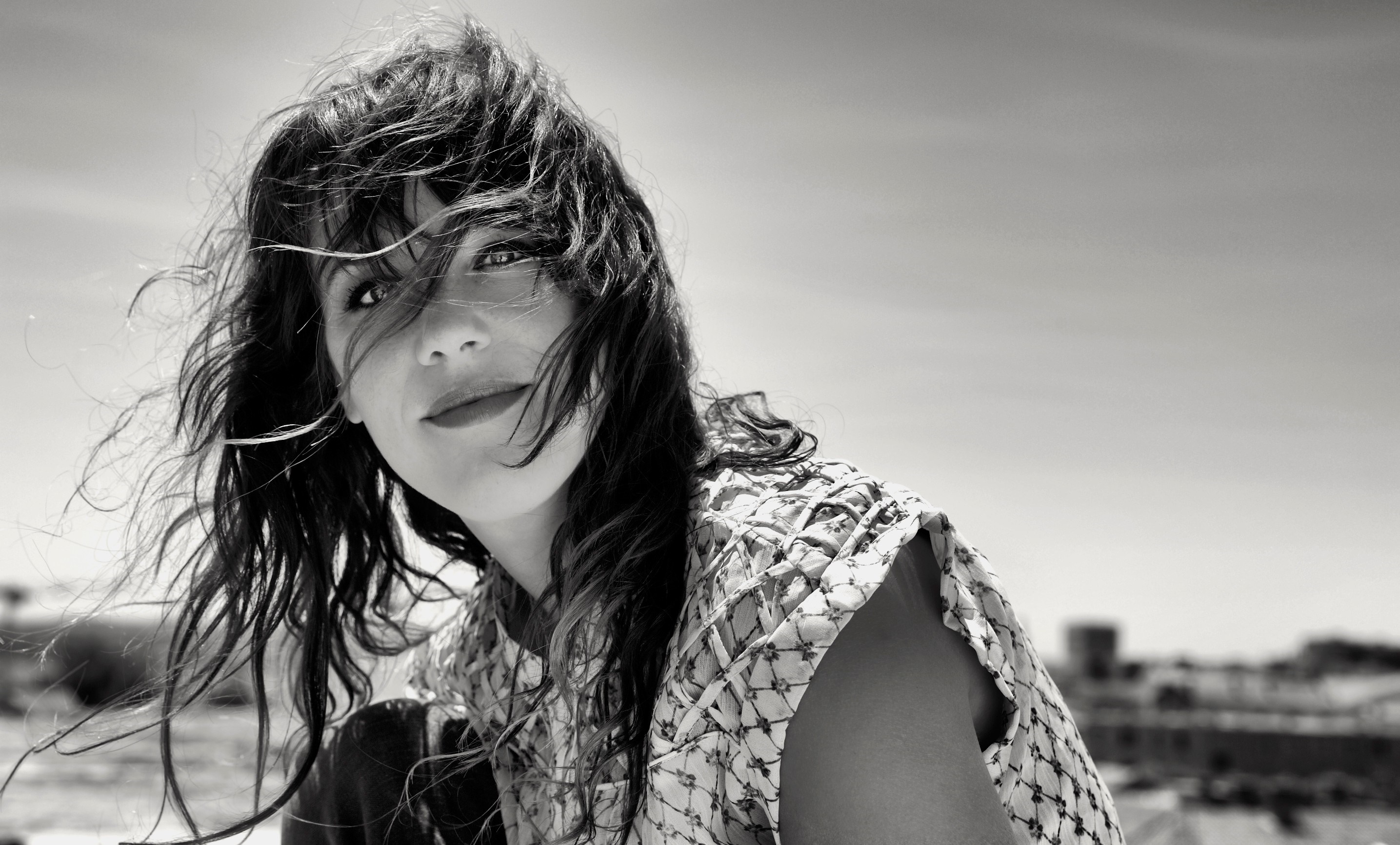 Monochrome portrait of a woman with windblown hair HD Wallpaper