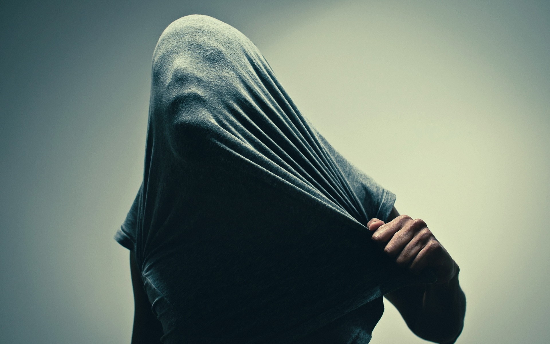 Person with head covered by a grey t-shirt HD Wallpaper