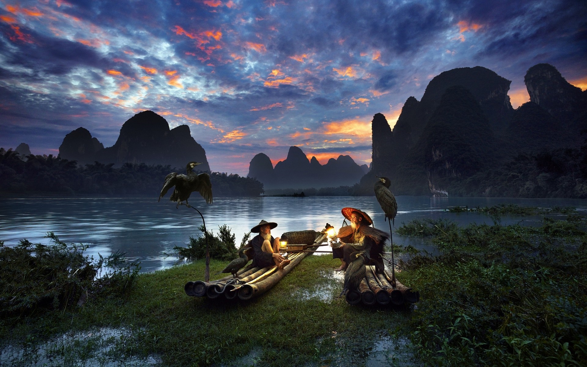 Fishermen with cormorants on a river at sunset in China HD Wallpaper