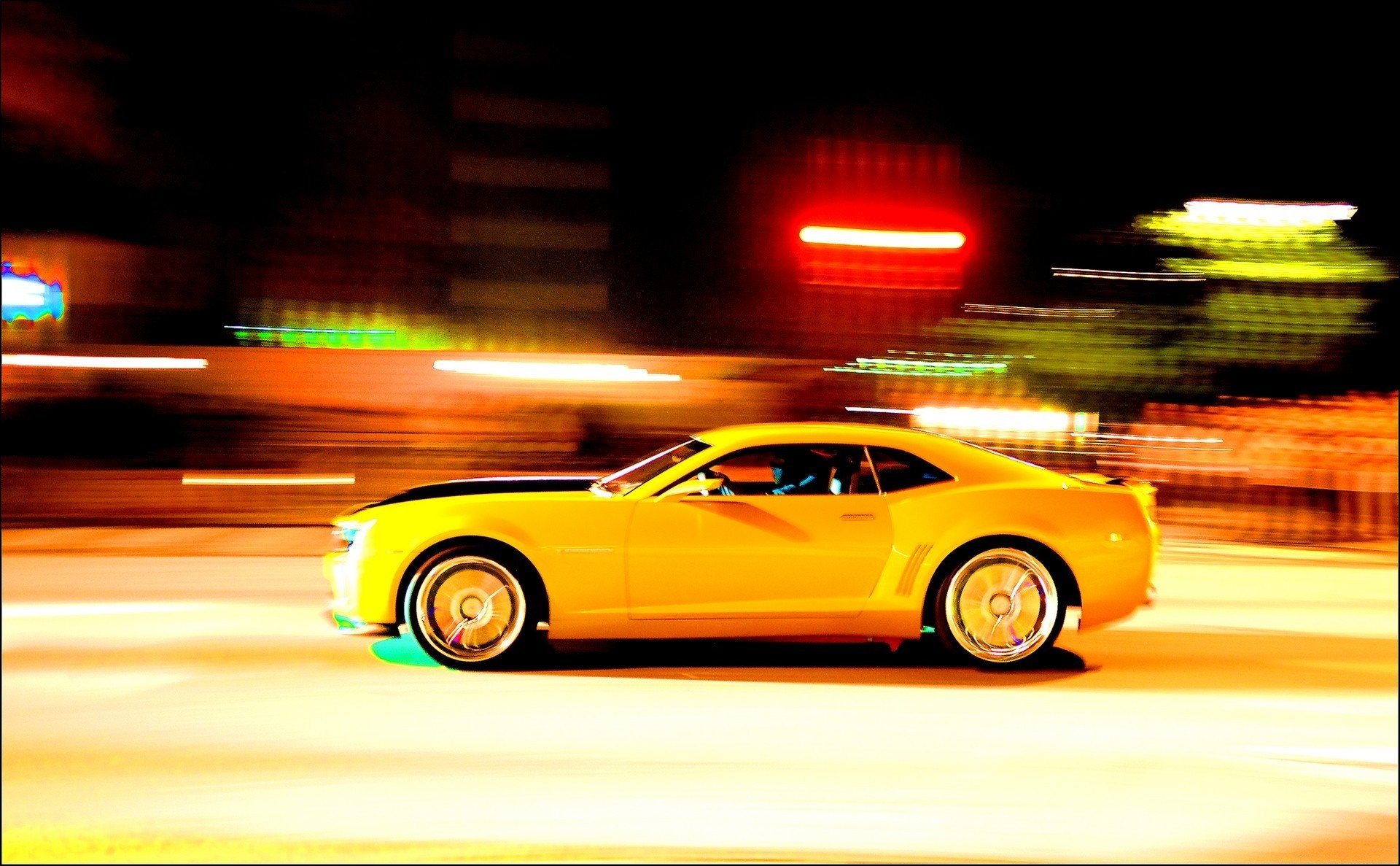 Yellow Chevrolet Camaro SS driving at night with motion blur HD Wallpaper