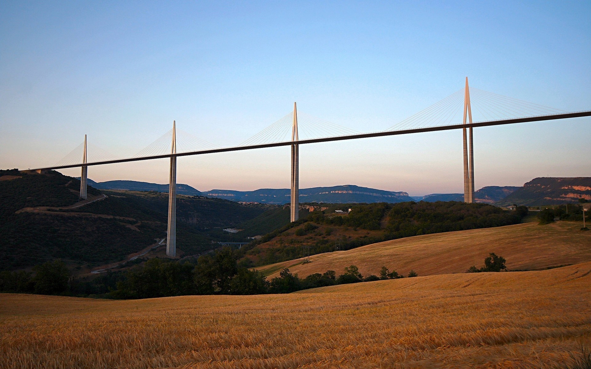 Millau Viaduct bridge over a valley at sunset HD Wallpaper