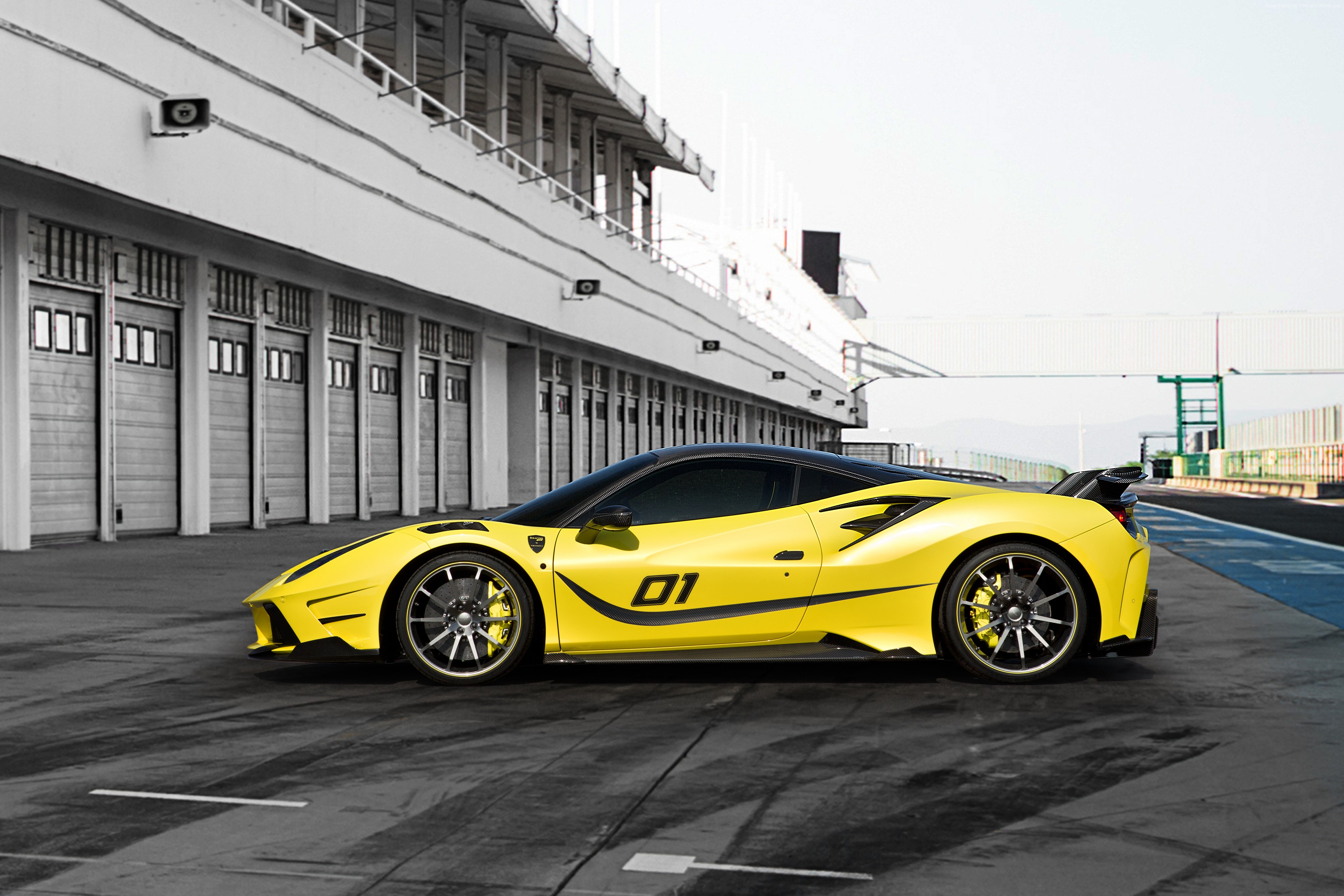 Yellow Mansory 4XX Siracusa sports car on a race track HD Wallpaper