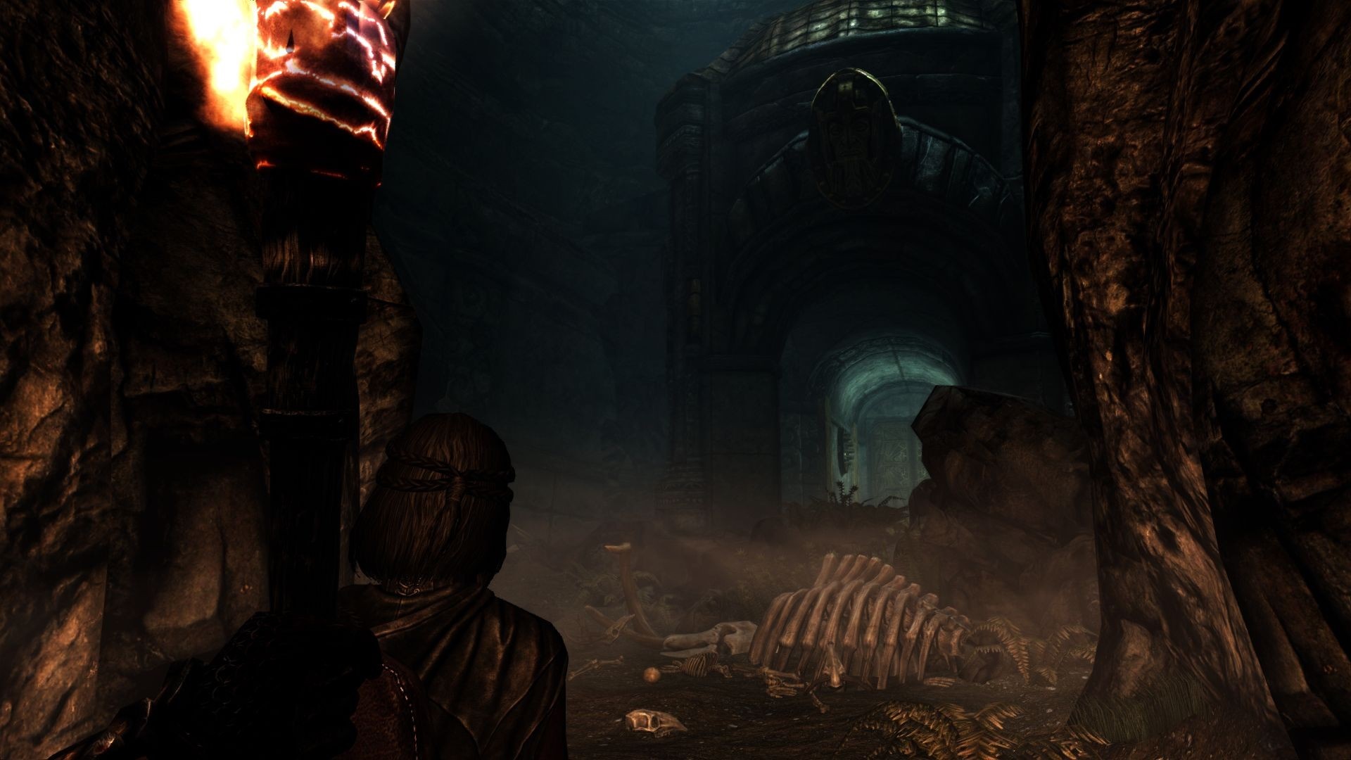 The Elder Scrolls V Skyrim cave with skeleton HD Wallpaper