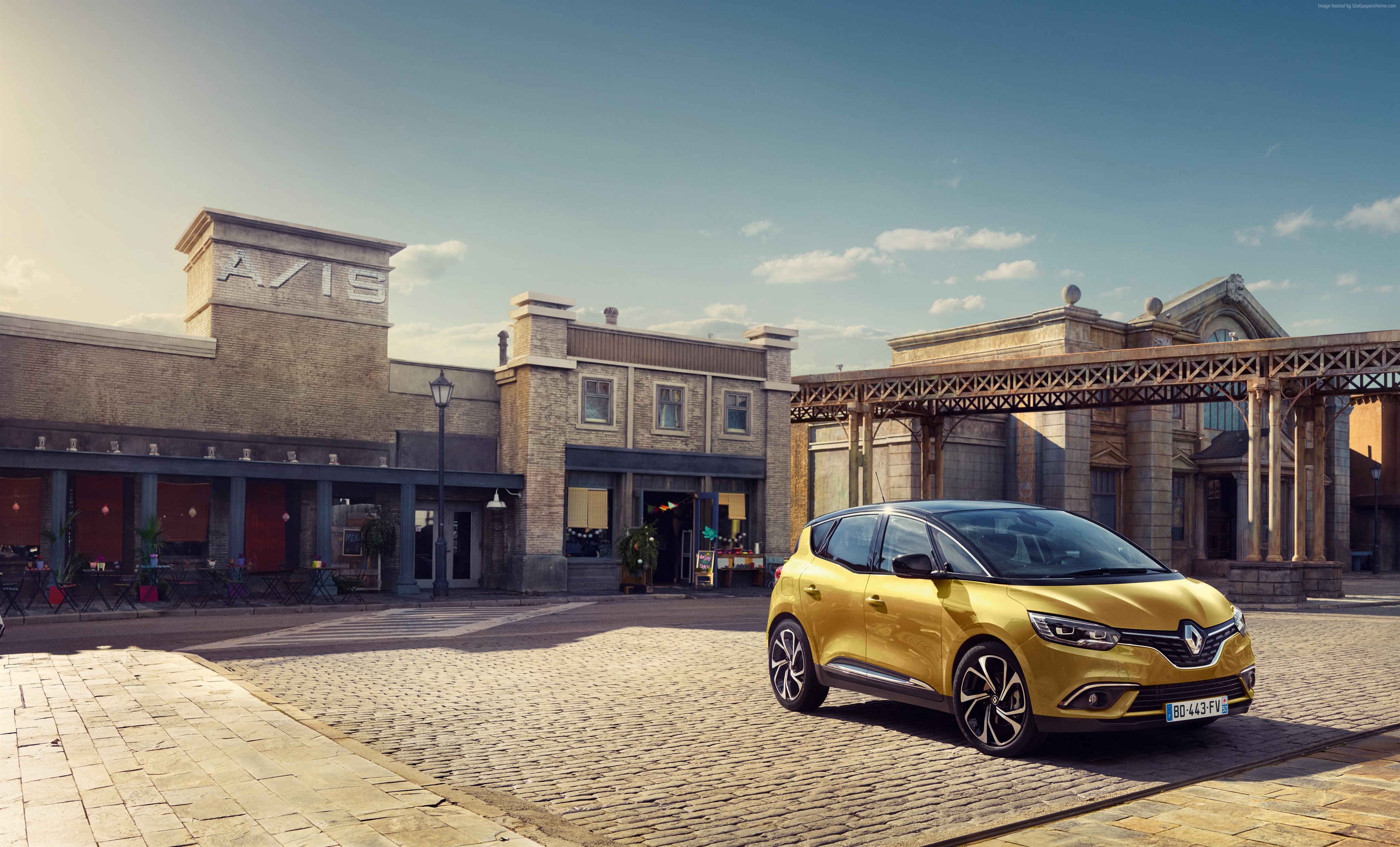 Gold Renault Scenic minivan parked on cobblestone street HD Wallpaper