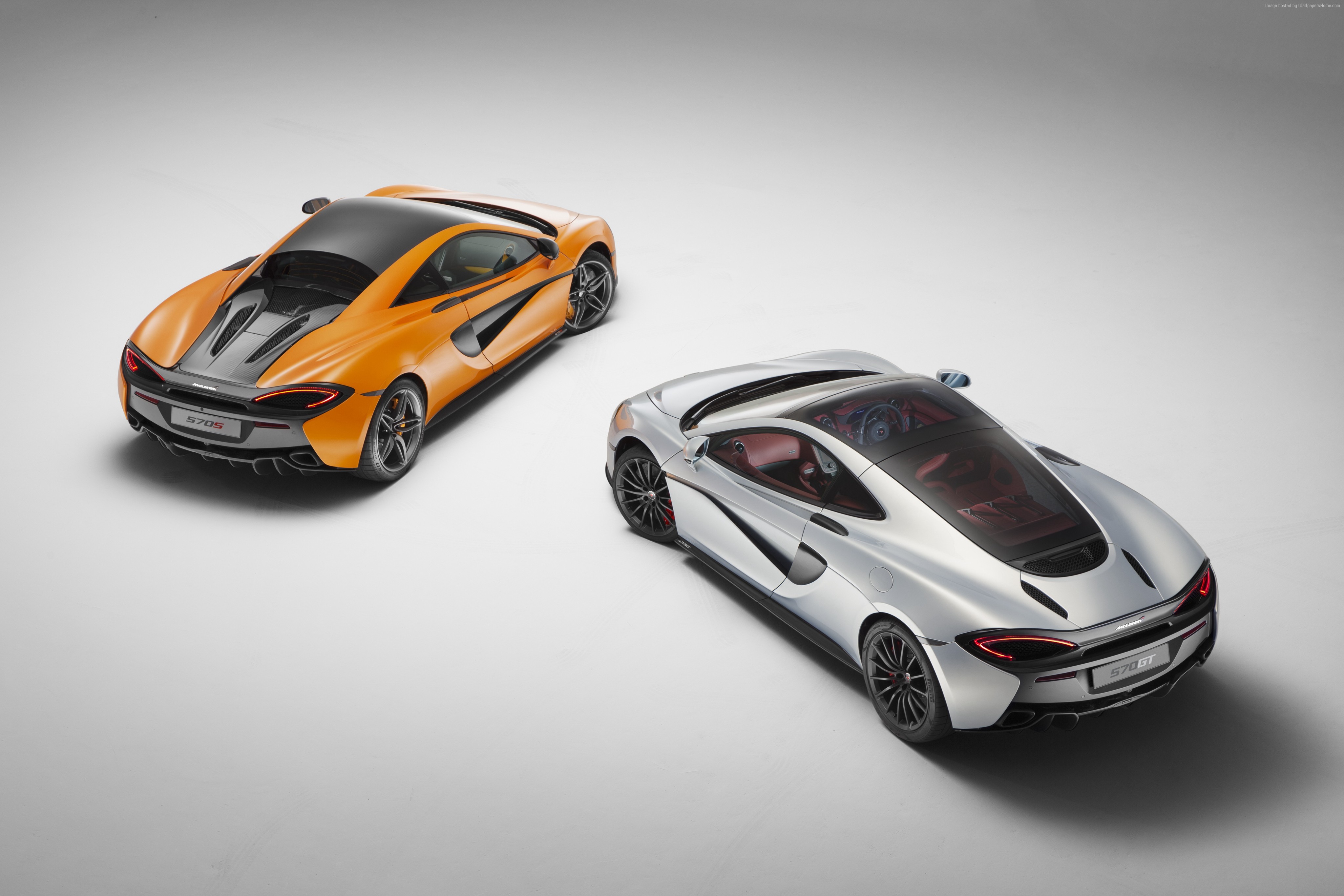 Two McLaren 570GT sports cars HD Wallpaper