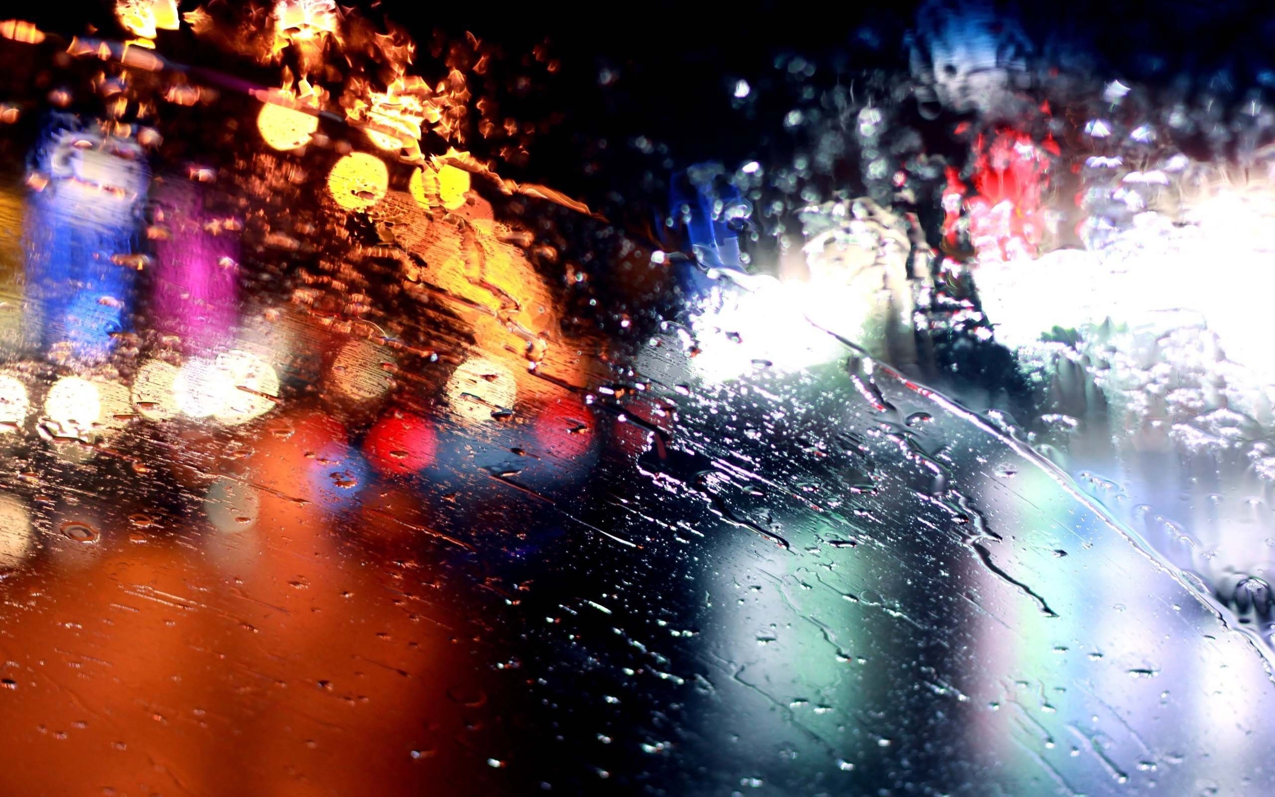 Rainy night city lights reflection on glass HD Wallpaper