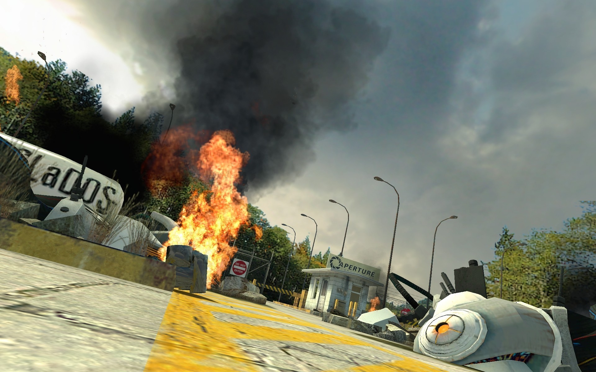 Portal GLaDOS wreckage with fire and Aperture Science building HD Wallpaper