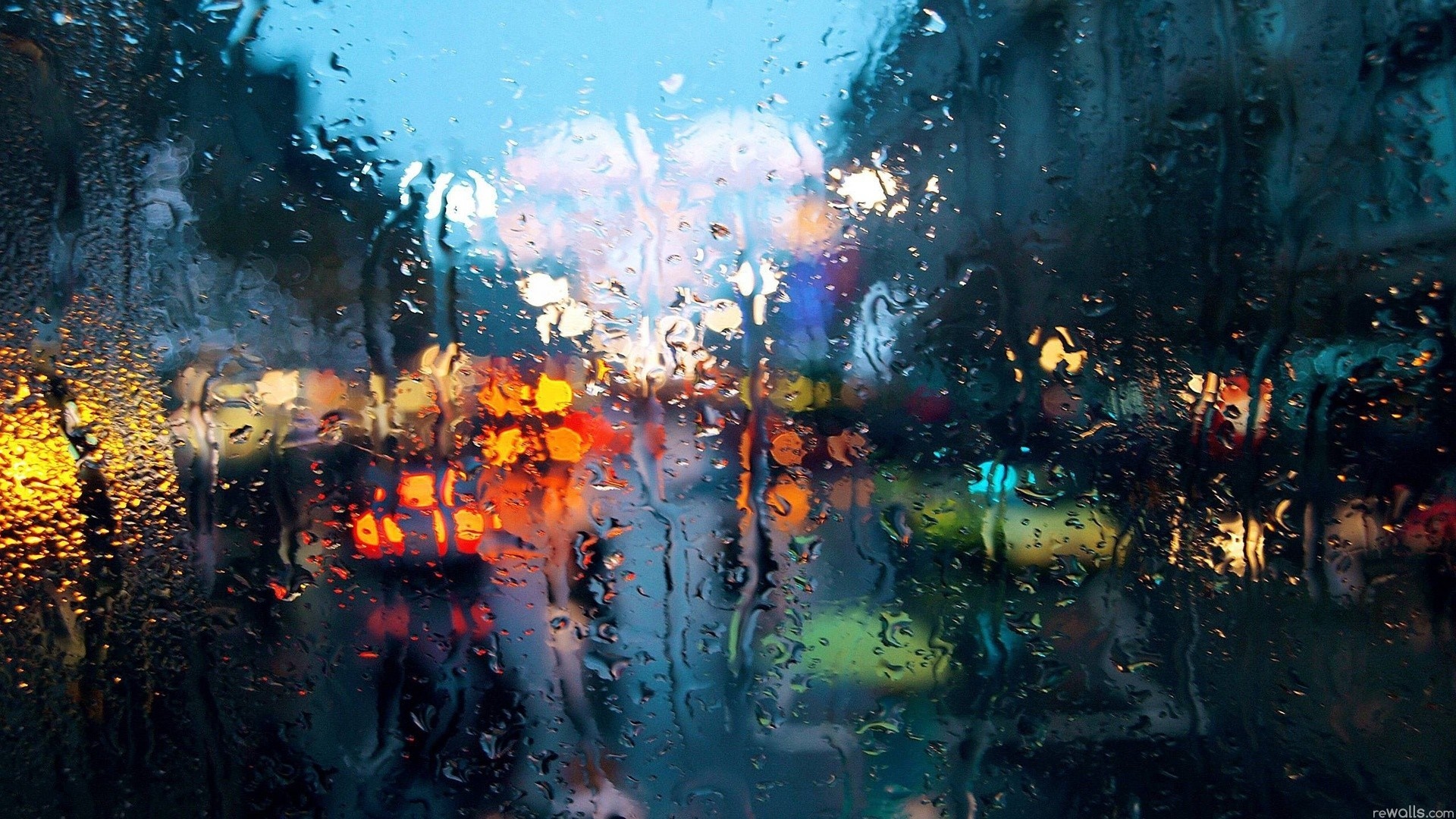 Rainy city lights through a wet window HD Wallpaper