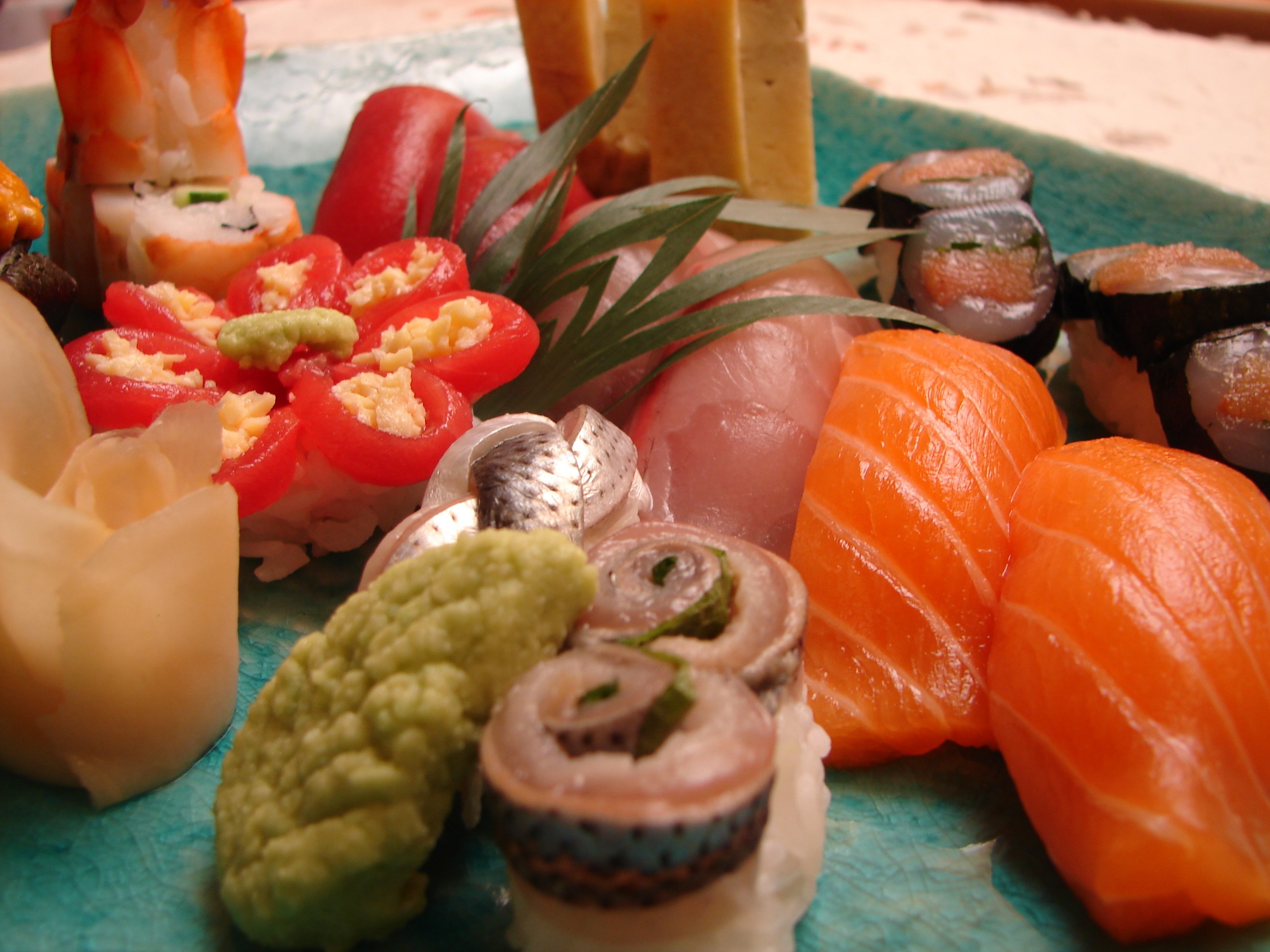Assortment of sushi and sashimi on a plate HD Wallpaper